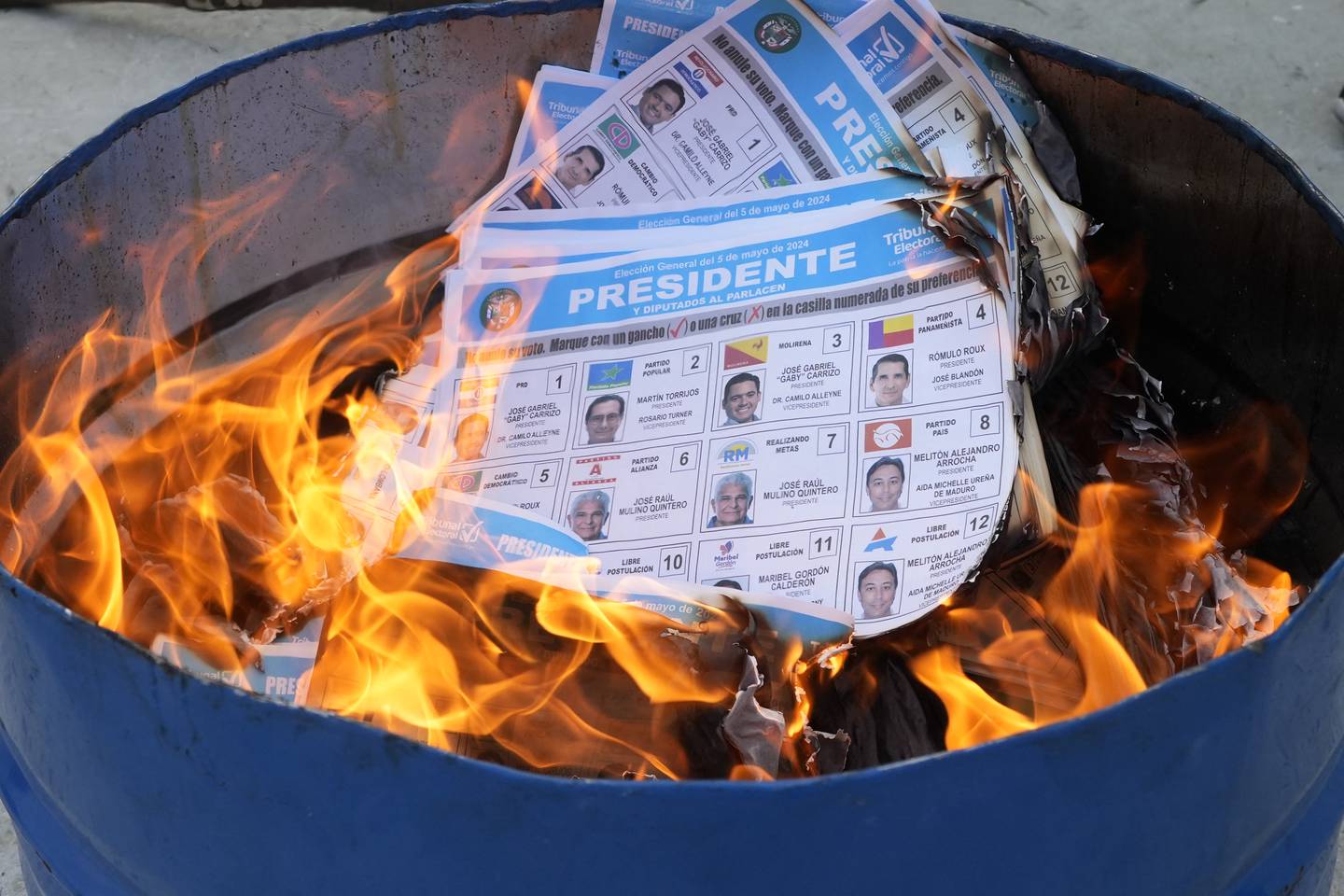 Unused ballots are burned by election officials after the closing of polling stations in Panama City on May 5, 2024, during Panama's presidential election. (Photo by ARNULFO FRANCO / AFP)