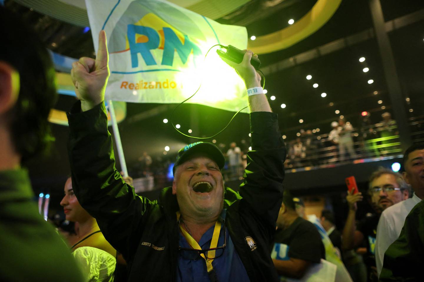 Supporters of Panama's presidential candidate for the Realizando Metas party, Jose Raul Mulino, celebrate the first results of the presidential election at his campaign headquarters in the Sheraton Hotel in Panama City on May 5, 2024. (Photo by Roberto CISNEROS / AFP)