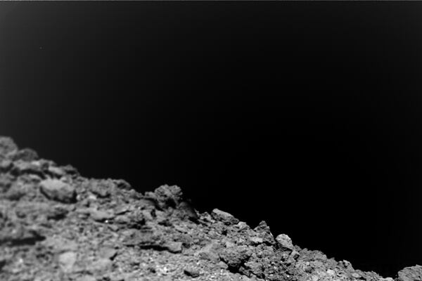 This undated photo courtesy of Jaumann et. al., Science 2019, shows a new image taken by the German-French Mobile Asteroid Surface Scout (MASCOT) on the surface of the near-Earth asteroid Ryugu. - Photographs snapped by a shoebox-sized probe that explored Ryugu have yielded new clues about its composition, insights that will help scientists understand the formation of our solar system. MASCOT hitched a ride on Japan's Hayabusa2 spaceship, touching down on the 900-meter (3000 feet) wide asteroid, whose orbit lies mostly between Earth and Mars, on October 3, 2018. 