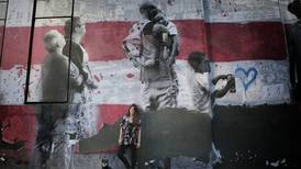 Fotografías de tica adornan mural en la Gran Manzana