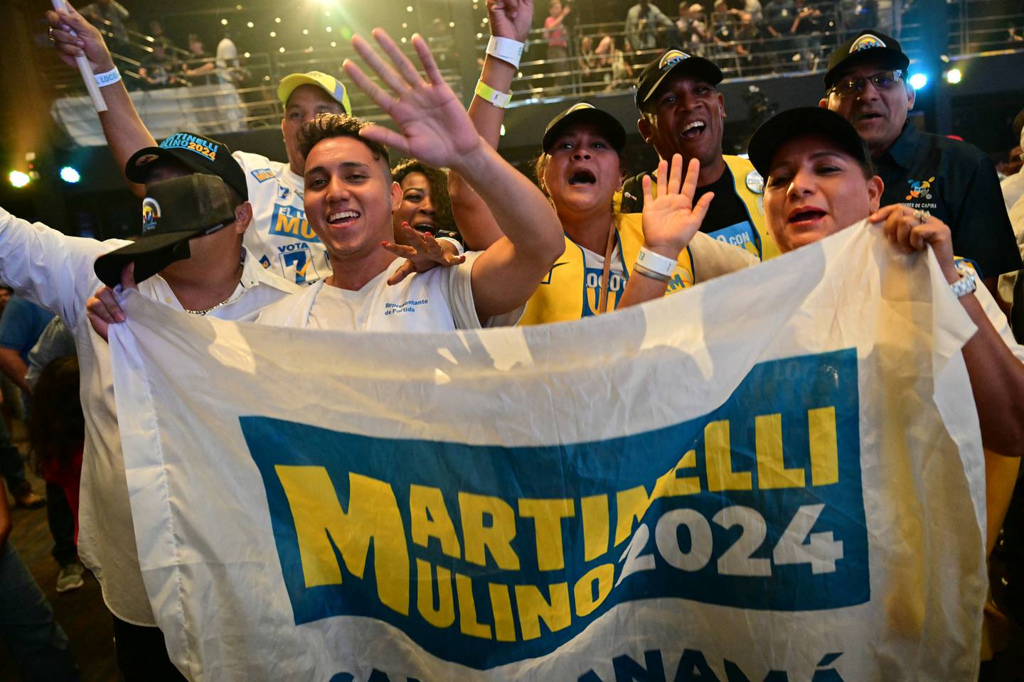 Supporters of Panama's presidential candidate for the Realizando Metas party, Jose Raul Mulino, celebrate the first results of the presidential election at his campaign headquarters in the Sheraton Hotel in Panama City on May 5, 2024. (Photo by MARTIN BERNETTI / AFP)