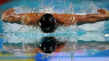 Ryan Lochte    batió  récord mundial de 100m estilos en piscina corta