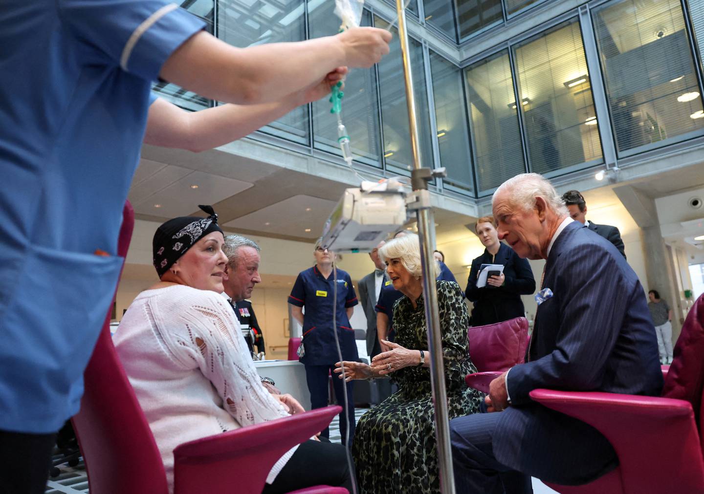 Britain's King Charles III and Britain's Queen Camilla recieve a bouquet of flowers after a visit to the University College Hospital Macmillan Cancer Centre in London on April 30, 2024. Charles is making his first official public appearance since being diagnosed with cancer, after doctors said they were "very encouraged" by the progress of his treatment. (Photo by HENRY NICHOLLS / AFP)