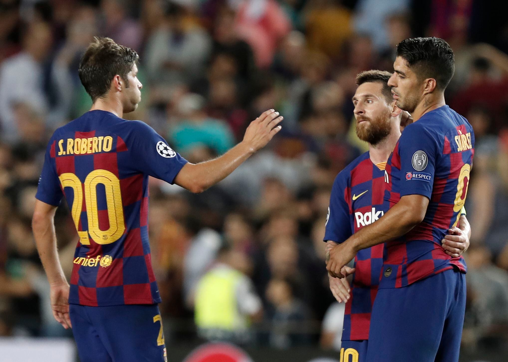 Barcelona's Luis Suarez, Lionel Messi, and Sergi Roberto celebrate at the end of group F Champions League soccer match between F.C. Barcelona and Inter Milan at the Camp Nou stadium in Barcelona, Spain, Wednesday, Oct. 2, 2019. (AP Photo/Joan Monfort)