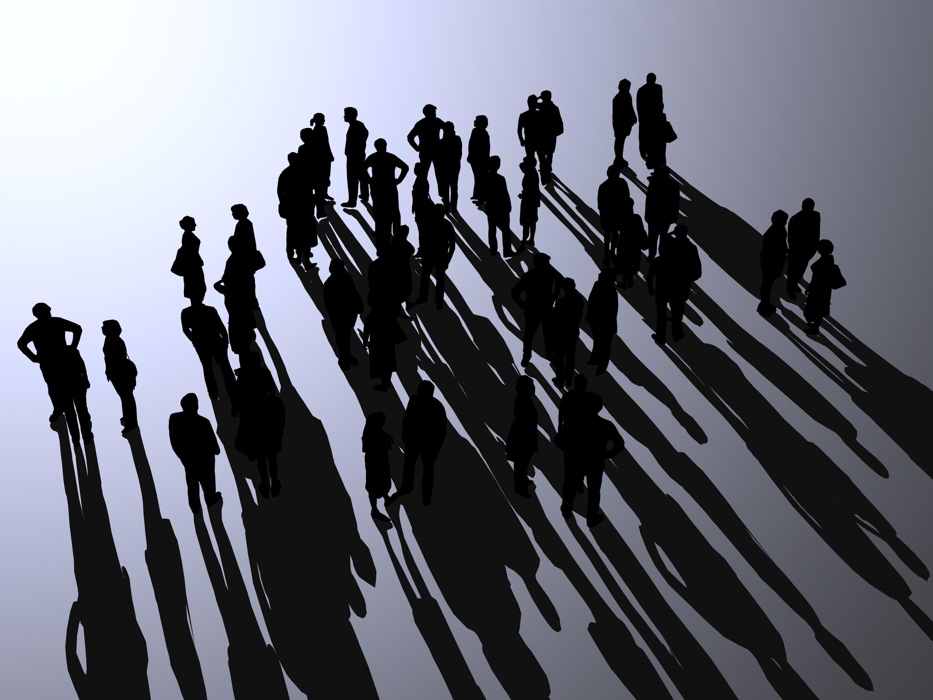 Grupo de personas (sus siluetas) y sus sombras proyectadas