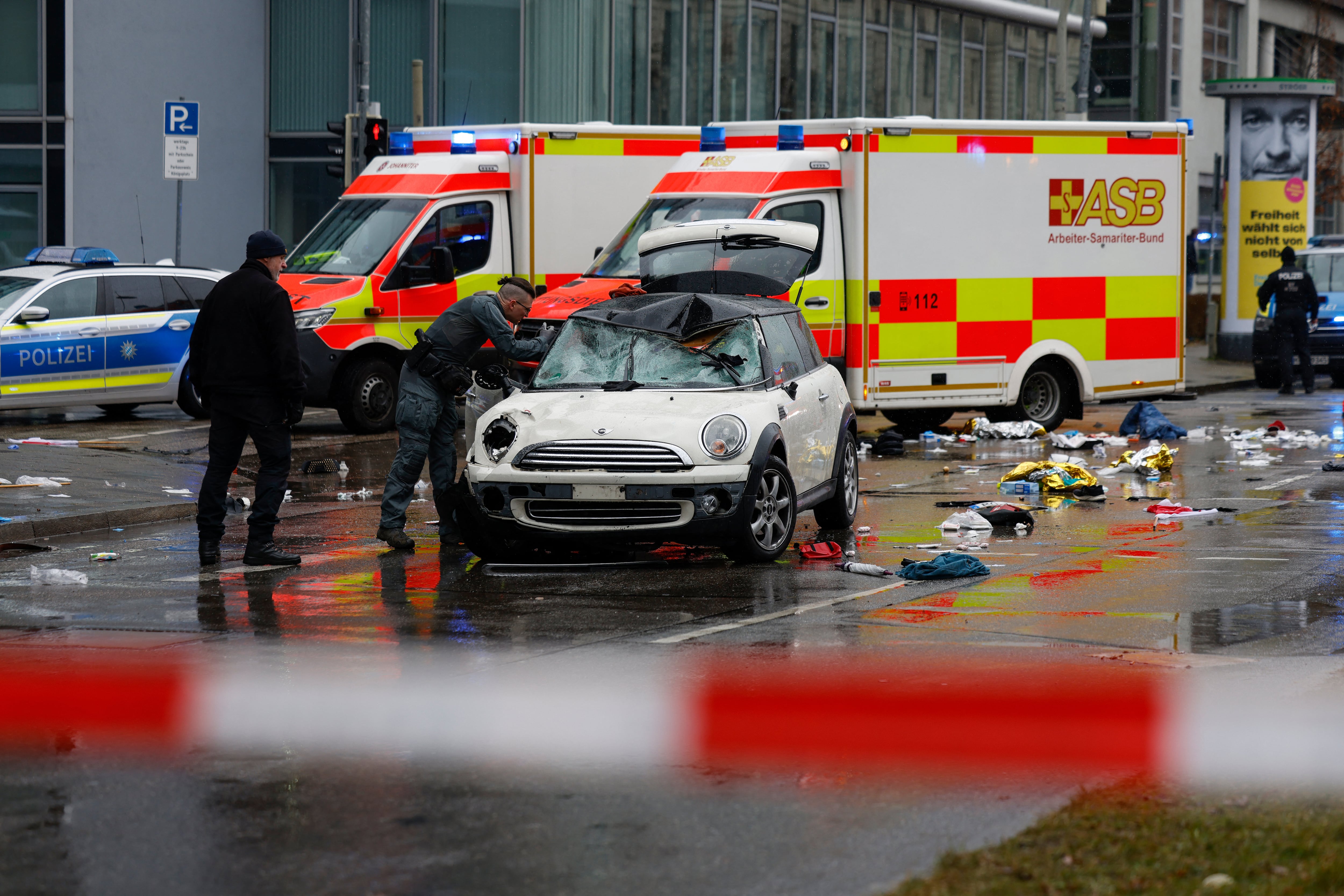 Members of the emergency services work at the scene where a car drove into a crowd in the southern German city of Munich on February 13, 2025 leaving several people injured, police said. Munich police said on social m