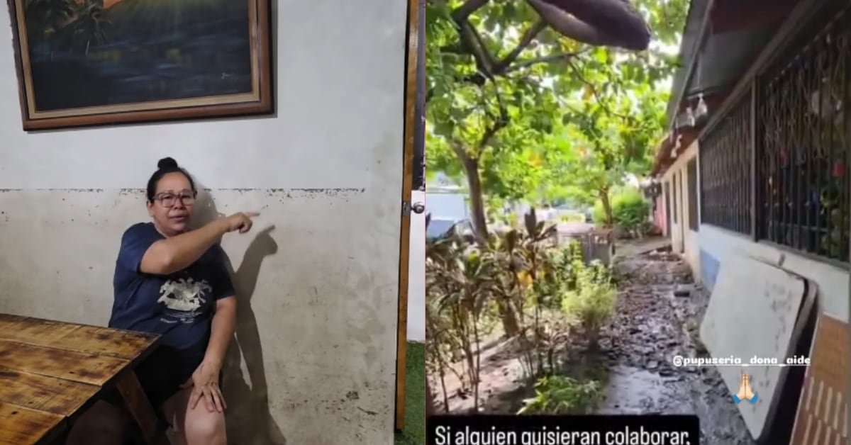 Aide Santos, dueña de la pupusería, señala hasta dónde llegó el agua en su local.