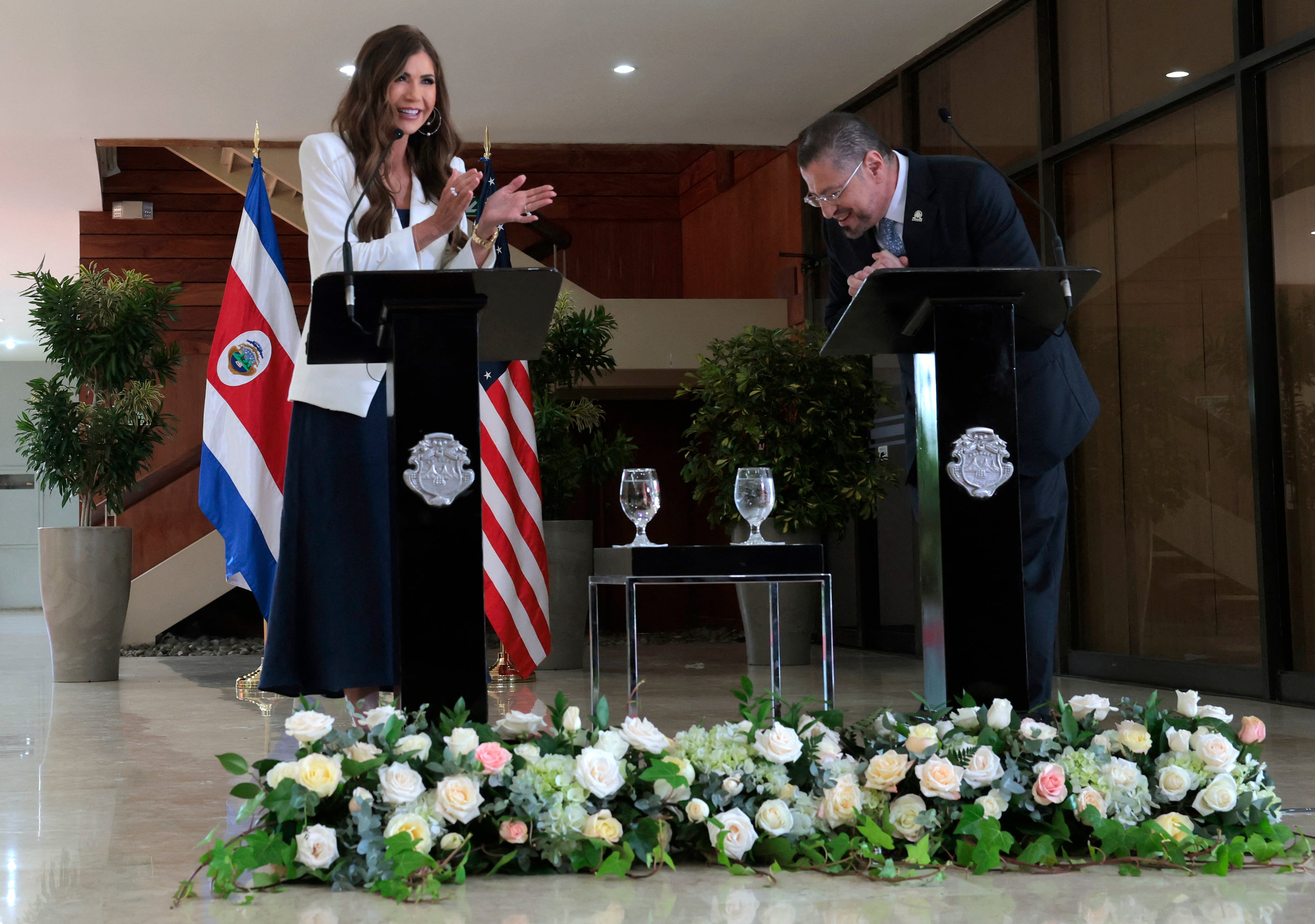 US Secretary of Homeland Security Kristi Noem (L) and President of Costa Rica Rodrigo Chaves Robles gesture as they hold a press conference at the Casa Presidencial on June 25, 2025 in San Jose, Costa Rica. Noem is traveling to several Central American countries where she will meet with political leaders and to learn about immigration programs and facilities backed by the US Department of Homeland Security in the region. (Photo by Anna Moneymaker / POOL / AFP)