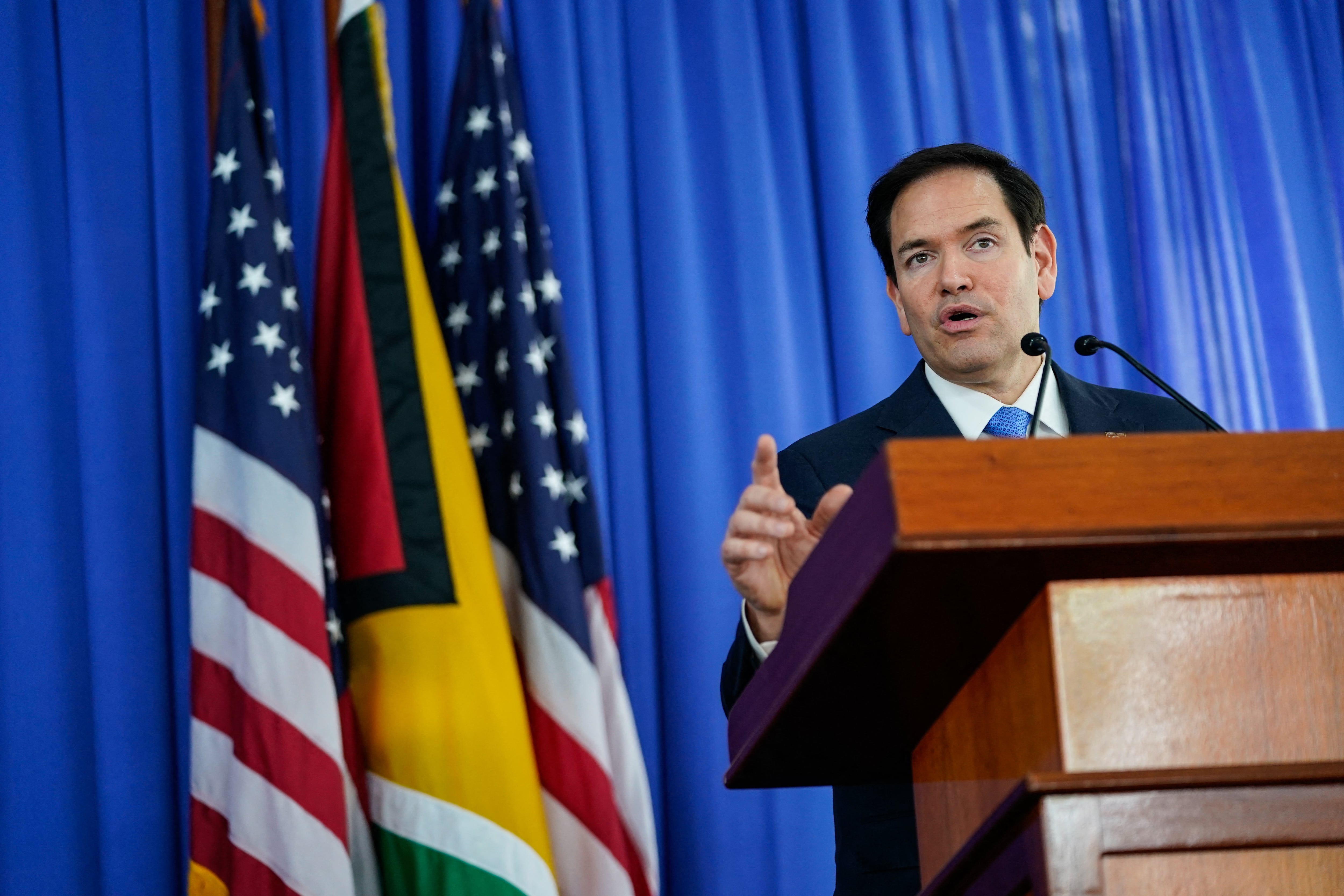 US Secretary of State Marco Rubio speaks during a press conference with Guyanese President Irfaan Ali (not pictured), in Georgetown, Guyana, on March 27, 2025. Secretary Rubio warned Venezuela on March 27 of consequences -- and hinted at military force -- if the country moves against oil-rich neighbor Guyana. "If they were to attack Guyana or attack ExxonMobil," Rubio said, "it would be a very bad day -- a very bad week -- for them. It would not end well."