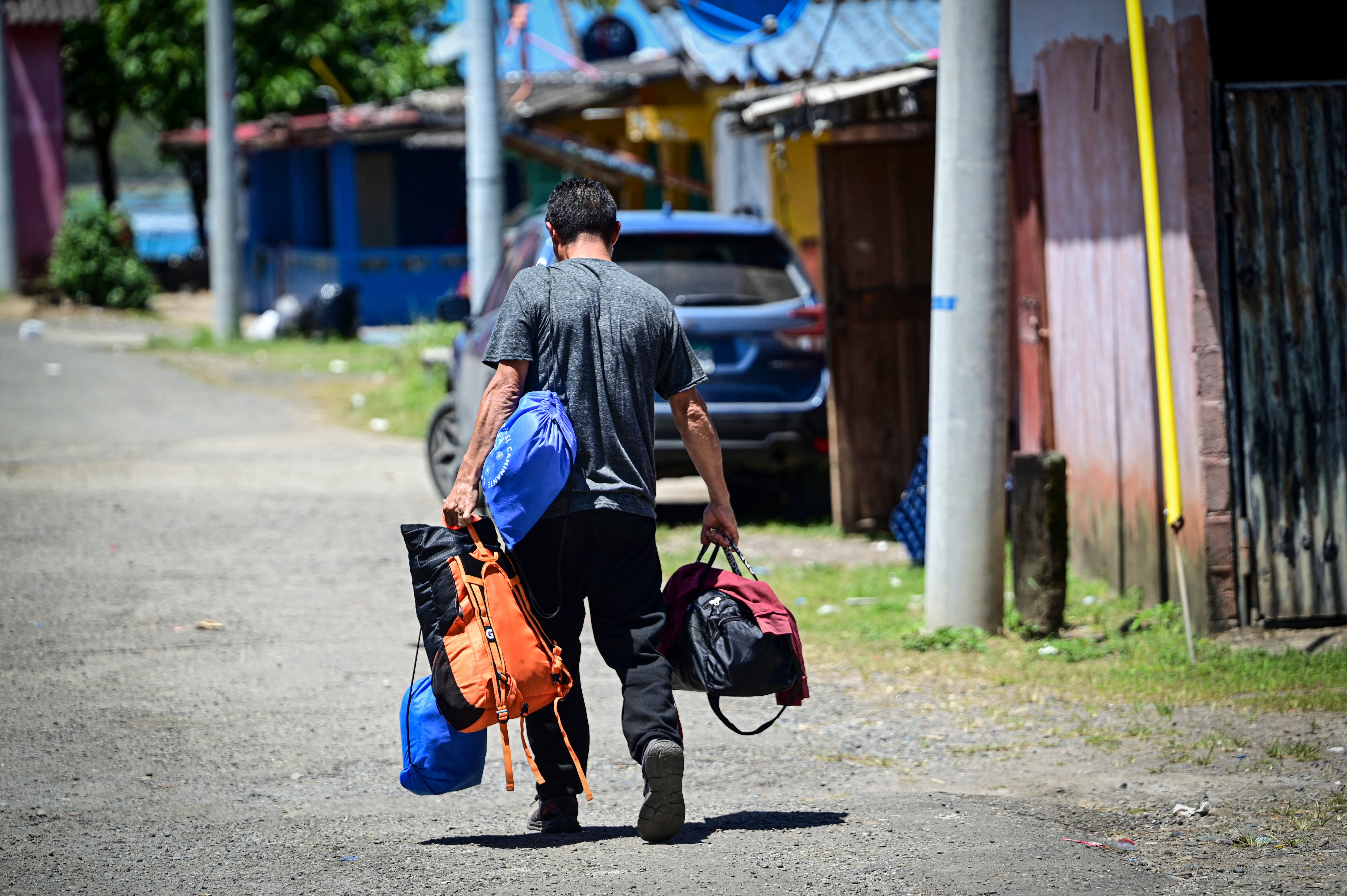 A Venezuelan migrant arrives to take a boat bound to Colombia in Miramar, near Palenque, Panama, on March 5, 2025. Although Central American governments say they are trying to organize reverse