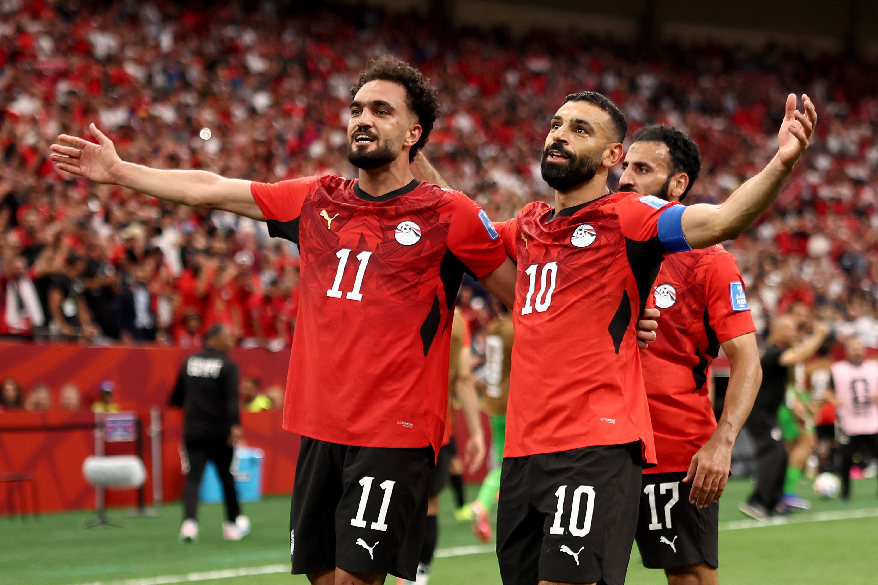 VANCOUVER, BRITISH COLUMBIA - JUNE 21: Mohamed Salah #10 of Egypt celebrates with Mostafa Zico #11 after scoring the team's second goal during the FIFA World Cup 2026 Group G match between New Zealand and Egypt at BC Place Vancouver on June 21, 2026 in Vancouver, British Columbia. Fran Santiago/Getty Images/AFP (Photo by Fran Santiago / GETTY IMAGES NORTH AMERICA / Getty Images via AFP)