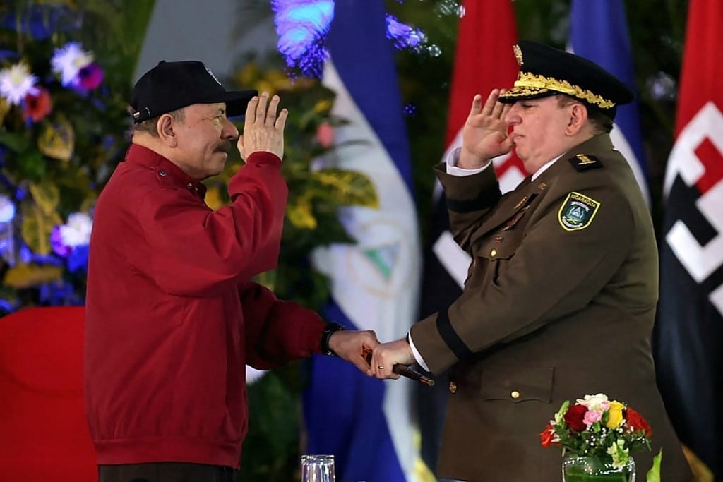 This handout picture released by the official El 19 Digital news outlet on February 21, 2025, shows Nicaragua's President Daniel Ortega (L) and the new Commander-in-Chief of the Army, Julio C�sar Avil�s Castillo, during his swearing-in ceremony at the Plaza La Fe in Managua. Nicaraguan President Daniel Ortega swore in on Friday General Julio C�sar Avil�s, sanctioned by the United States, as head of the Army for another six years, in addition to the 15 years he has already been in office. (Photo by Jairo CAJINA / El 19 DIGITAL / AFP) / RESTRICTED TO EDITORIAL USE - MANDATORY CREDIT "AFP PHOTO / El 19 DIGITAL / JAIRO CAJINA" - NO MARKETING NO ADVERTISING CAMPAIGNS - DISTRIBUTED AS A SERVICE TO CLIENTS
