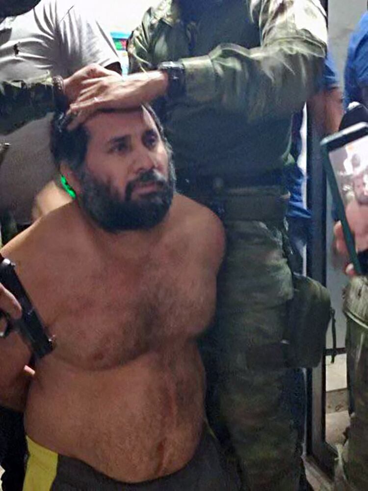 This handout picture released by the Ecuadorean Army shows drug trafficker Adolfo Macias, alias Fito, after being recaptured in Manta, Manabi Province, Ecuador, on June 25, 2025. Ecuadorian security forces recaptured fugitive "Fito," the country's most wanted drug trafficker, whose escape in January 2024 sparked an unprecedented wave of violence, President Daniel Noboa reported on June 25. (Photo by Handout / Ecuadorean Army / AFP) / RESTRICTED TO EDITORIAL USE - MANDATORY CREDIT "AFP PHOTO / ECUADOREAN ARMY" - NO MARKETING NO ADVERTISING CAMPAIGNS - DISTRIBUTED AS A SERVICE TO CLIENTS