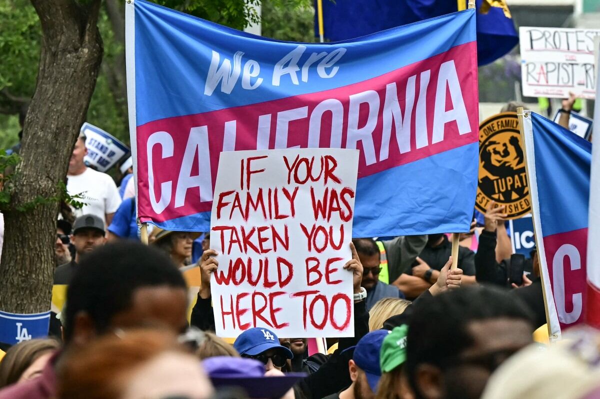 Demonstrators rally against US Immigration and Customs Enforcement (ICE) and call for the release of union leader David Huerta, President of SEIU California and SEIU-USWW, who was arrested on June 6 during federal immigration operations, at Gloria Molina Grand Park in Los Angeles, on June 9, 2025. Police ordered the public to disperse from downtown Los Angeles on June 8 after further unrest, with cars torched and security forces firing tear gas at protesters, in the wake of US President Donald Trump's deployment of National Guard troops to America's second-biggest city. Protests in Los Angeles, home to a large Latino population, broke out on June 6, triggered by immigration raids that resulted in dozens of arrests of what authorities say are illegal migrants and gang members. (Photo by Frederic J. Brown / AFP)