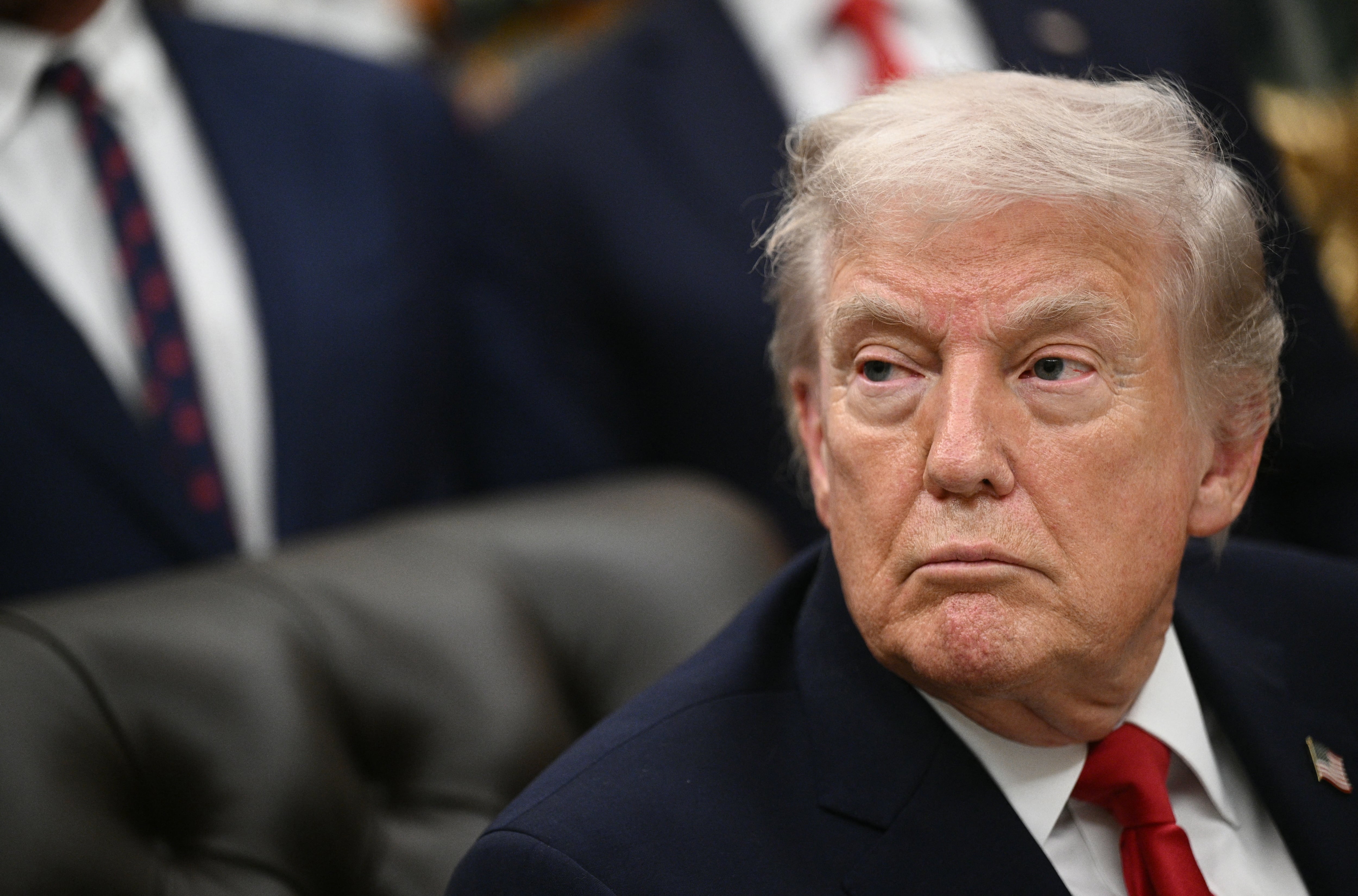 US President Donald Trump looks on after signing the "Great American Recovery Initiative" aimed at combating addiction and substance abuse in the Oval Office of the White House in Washington, DC, on January 29, 2026. (Photo by Brendan SMIALOWSKI / AFP)
