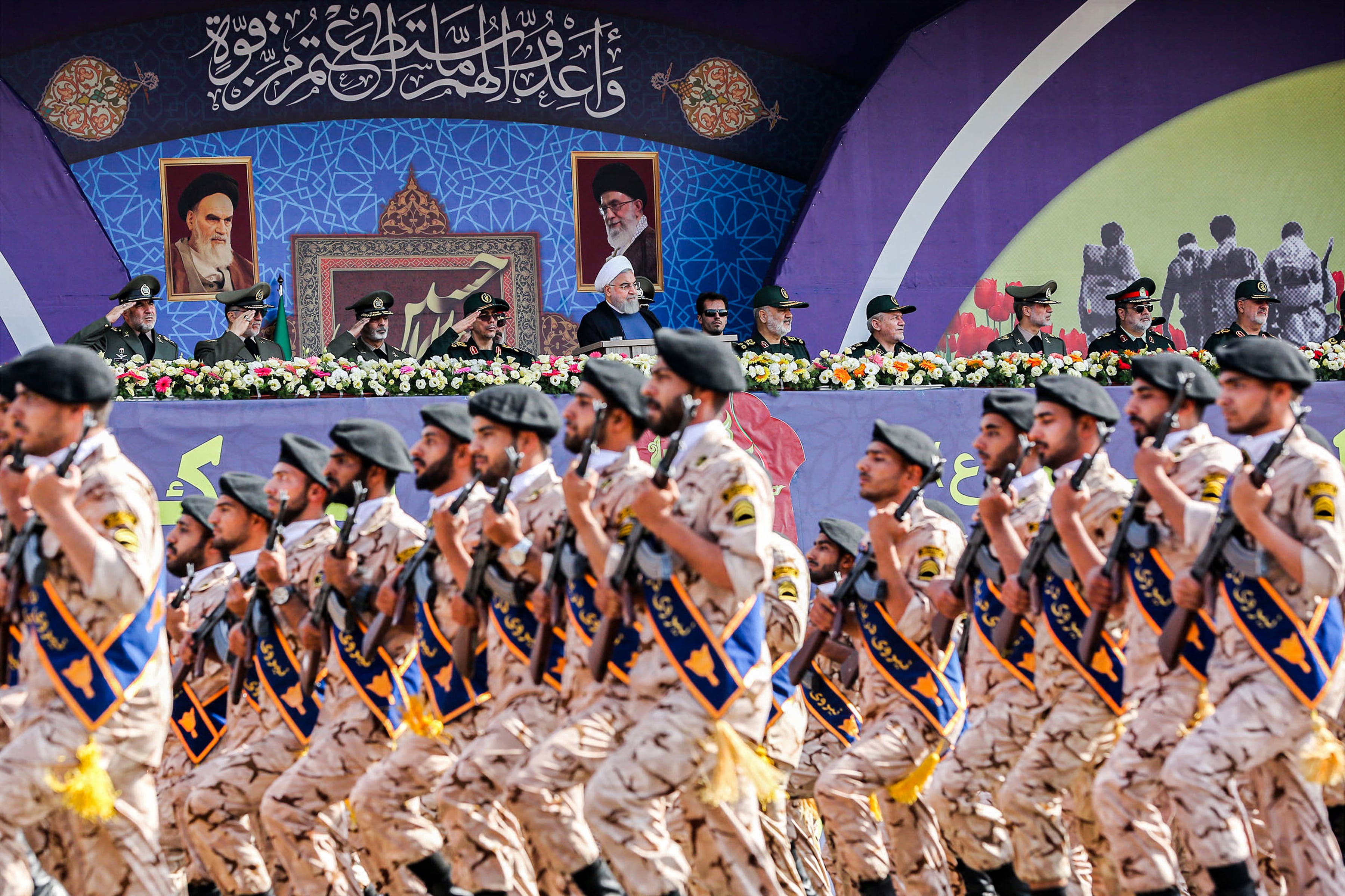 (FILES) This handout picture provided by the Iranian presidency on September 22, 2019 shows President Hassan Rouhani (C) and other top military commanders watching members the Islamic Revolutionary Guard Corps (IRGC) marching past during the annual "Sacred Defence Week" military parade marking the anniversary of the outbreak of the devastating 1980-1988 war with Saddam Hussein's Iraq, in Tehran. Iran's IRGC is the ideological army of the Islamic republic tasked with protecting the revolution from external and domestic threats but is accused by the West of militant activity abroad and serial rights violations at home. The EU is expected on January 29, 2026 to agree to list it as a terrorist organisation, matching similar classification enacted by the US, Canada, and Australia.
