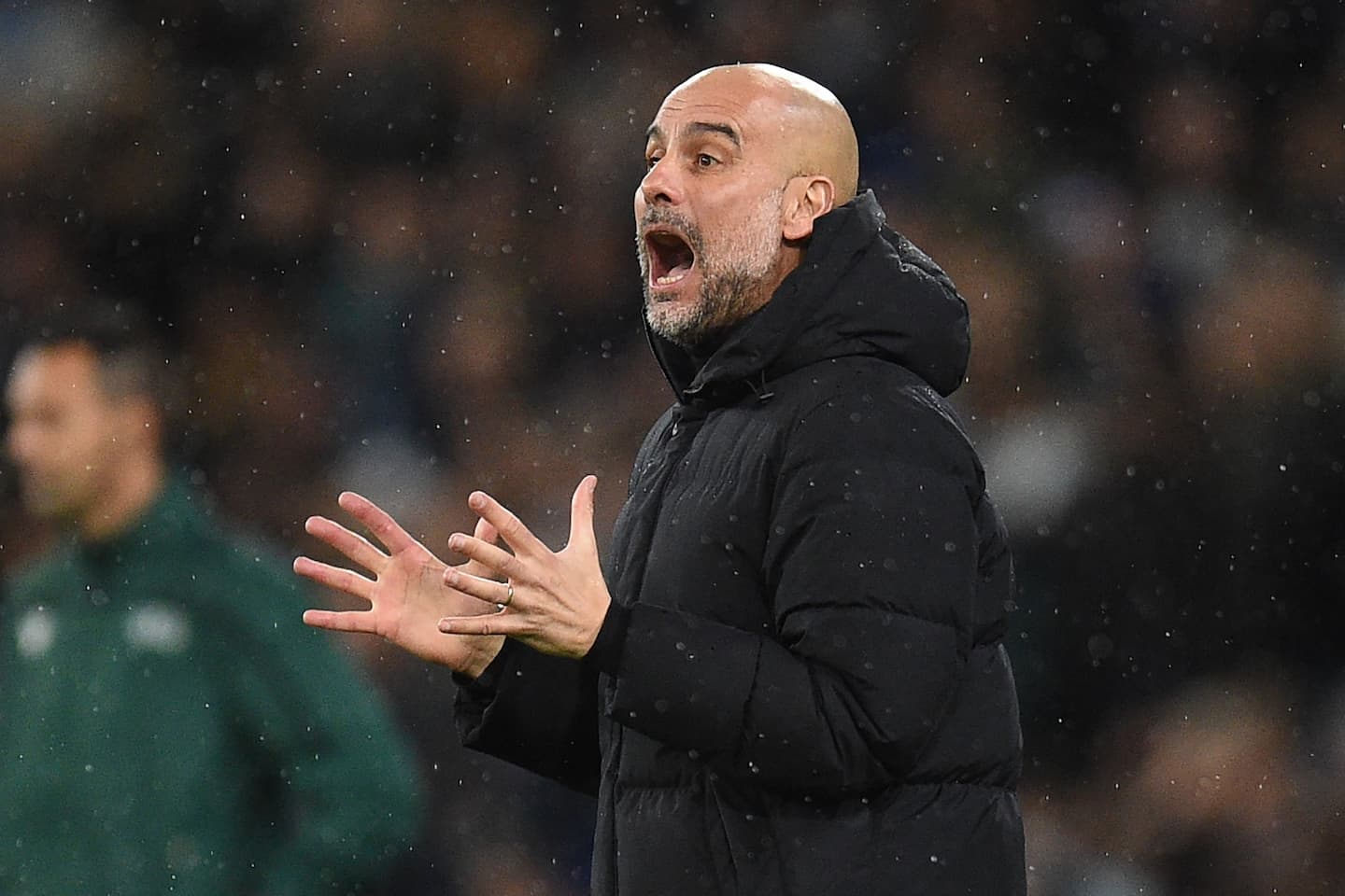 Manchester City's Spanish manager Pep Guardiola gestures on the touchline during the UEFA Champions League Quarter-final first leg football match between Manchester City and Atletico Madrid at the Etihad Stadium in Manchester, north west England, on April 5, 2022. (Photo by Oli SCARFF / AFP)