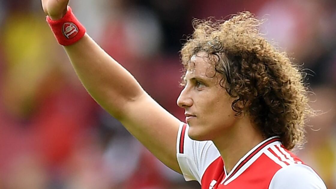 Arsenal's Brazilian defender David Luiz gestures to supporters on the pitch after the English Premier League football match between Arsenal and Burnley at the Emirates Stadium in London on August 17, 2019. - Arsenal won the game 2-1. (Photo by Daniel LEAL-OLIVAS / AFP) / RESTRICTED TO EDITORIAL USE. No use with unauthorized audio, video, data, fixture lists, club/league logos or 'live' services. Online in-match use limited to 120 images. An additional 40 images may be used in extra time. No video emulation. Social media in-match use limited to 120 images. An additional 40 images may be used in extra time. No use in betting publications, games or single club/league/player publications. /