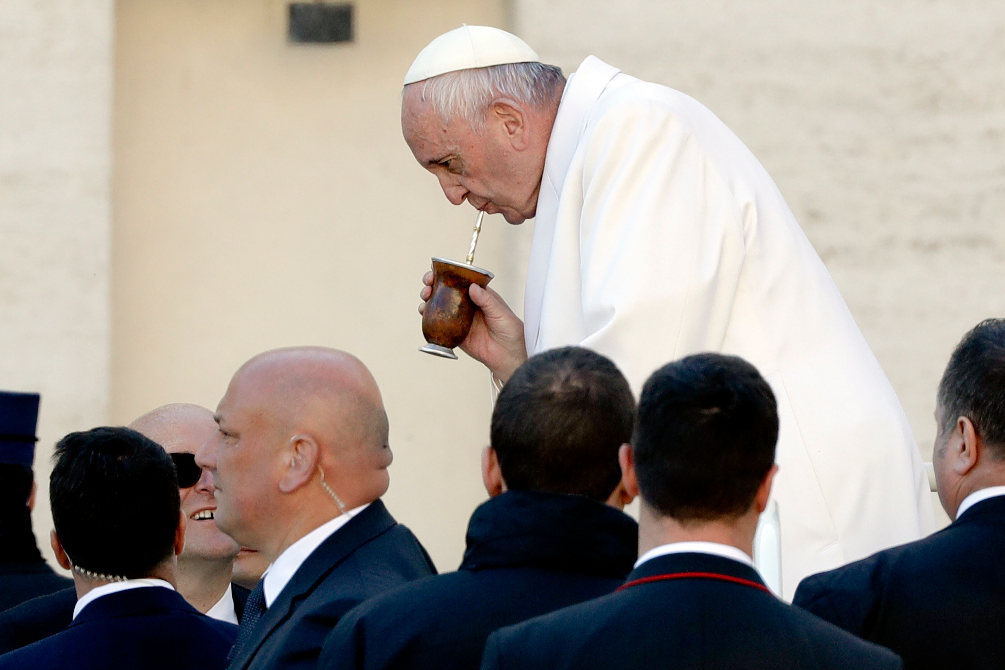 Pope Francis drinks from a mate gourd as he leaves at the end of his weekly general audience, in St. Peter's Square, at the Vatican, Wednesday, Jan. 24, 2018. (AP Photo/Andrew Medichini)