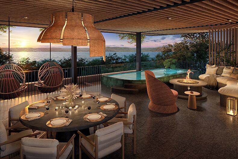 Espacio interior con piscina, comedor y vista al mar, parte de las amenidades de las residencias del St. Regis Papagayo en Costa Rica.
