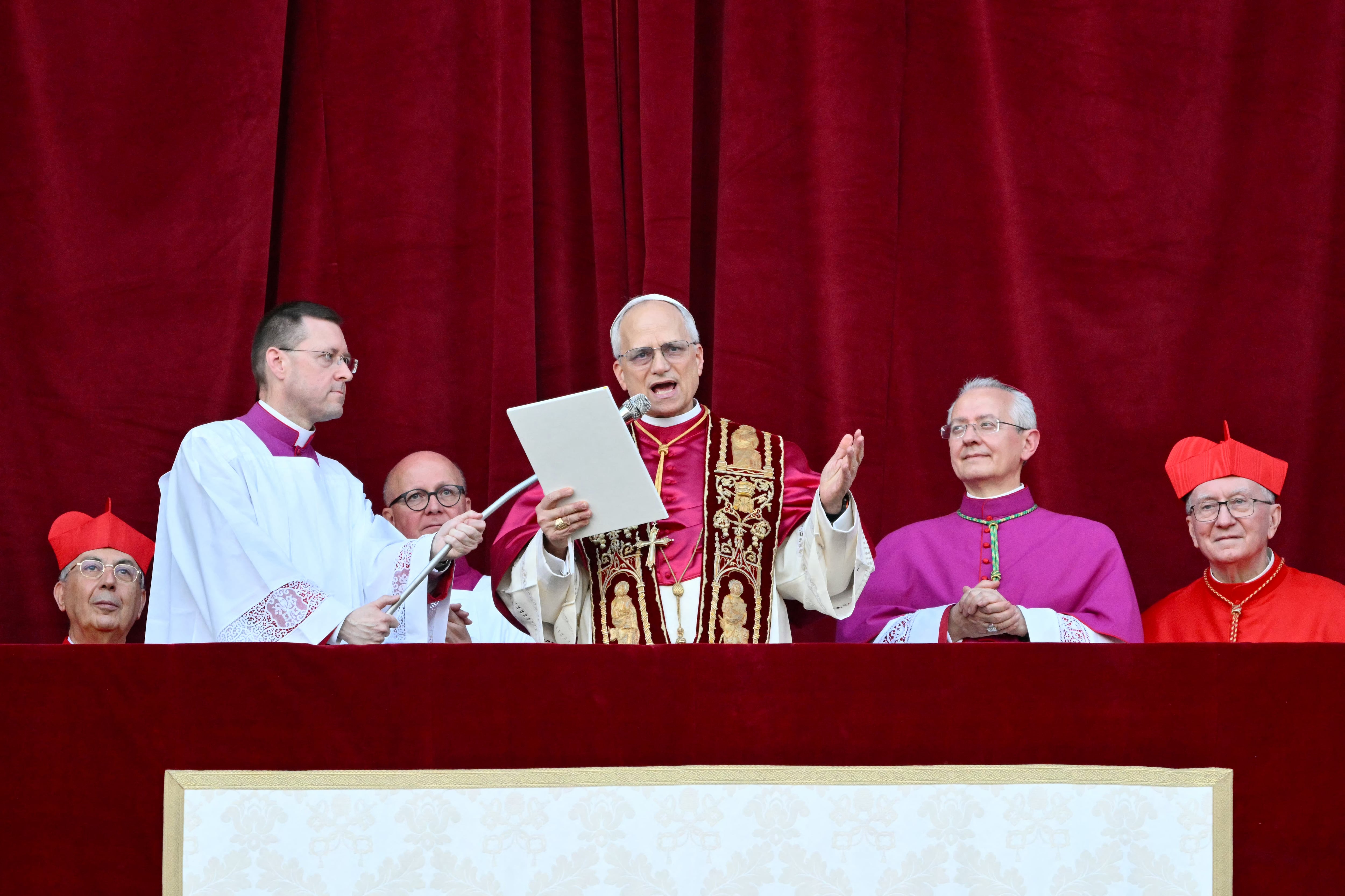 Newly elected Pope Leo XIV, Robert Prevost addresses the crowd from the main central loggia balcony of the St Peter's Basilica for the first time, after the cardinals ended the conclave, in The Vatican, on May 8, 2025. Robert Francis Prevost was on Thursday elected the first pope from the United States, the Vatican announced. A moderate who was close to Pope Francis and spent years as a missionary in Peru, he becomes the Catholic Church's 267th pontiff, taking the papal name Leo XIV. (Photo by Alberto PIZZOLI / AFP)