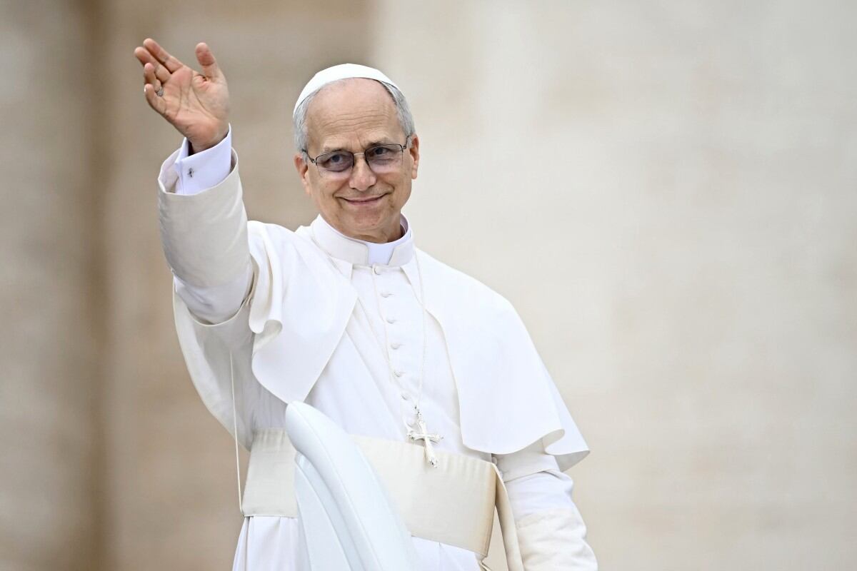 Pope Leo XIV waves to the crowd during the weekly general audience at St Peter's Square in The Vatican on May 21, 2025. (Photo by Filippo MONTEFORTE / AFP)