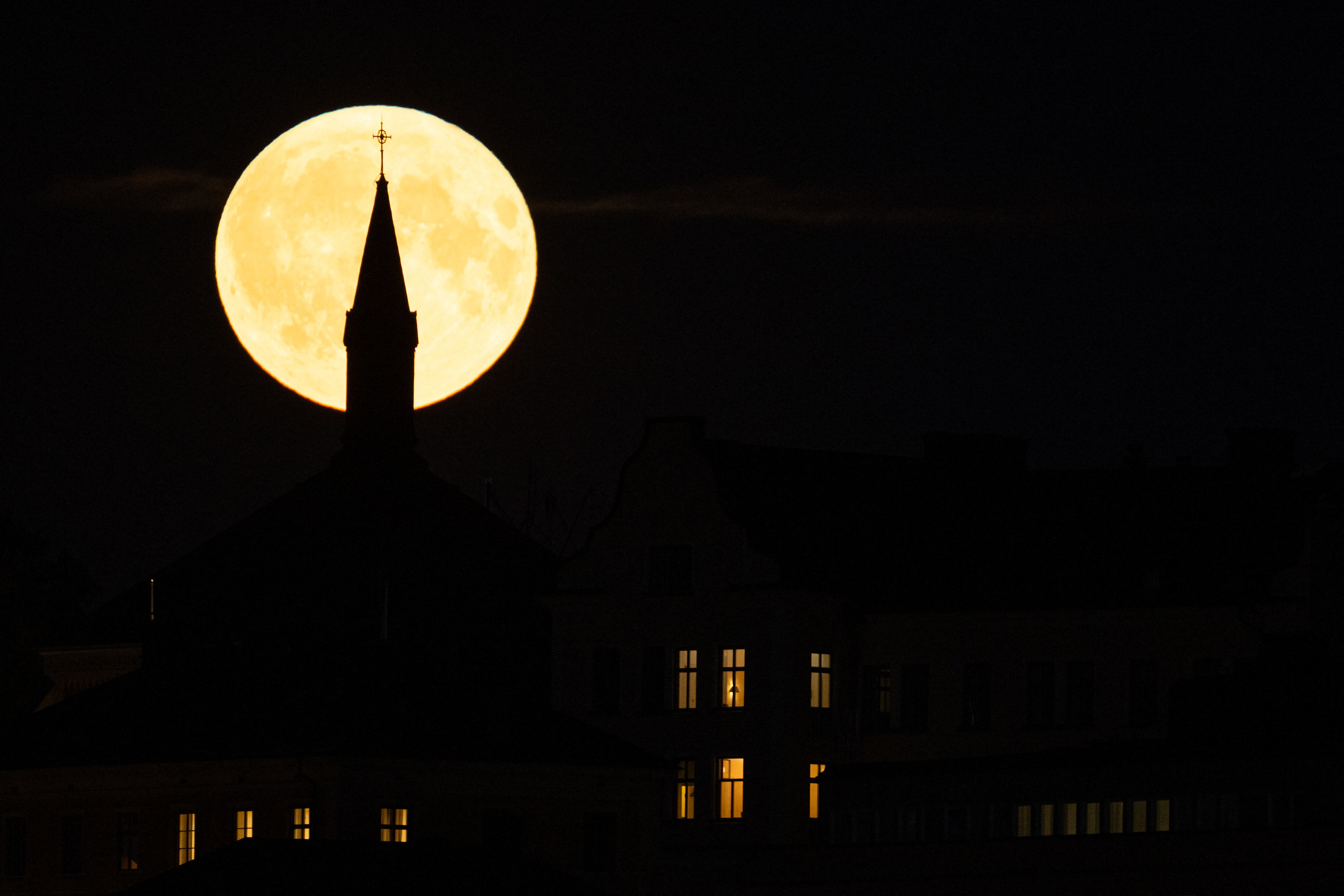 This photograph shows a Super Blue Moon rising behind Sodermalm, in Stockholm, on August 19, 2024. (Photo by Jonathan NACKSTRAND / AFP)