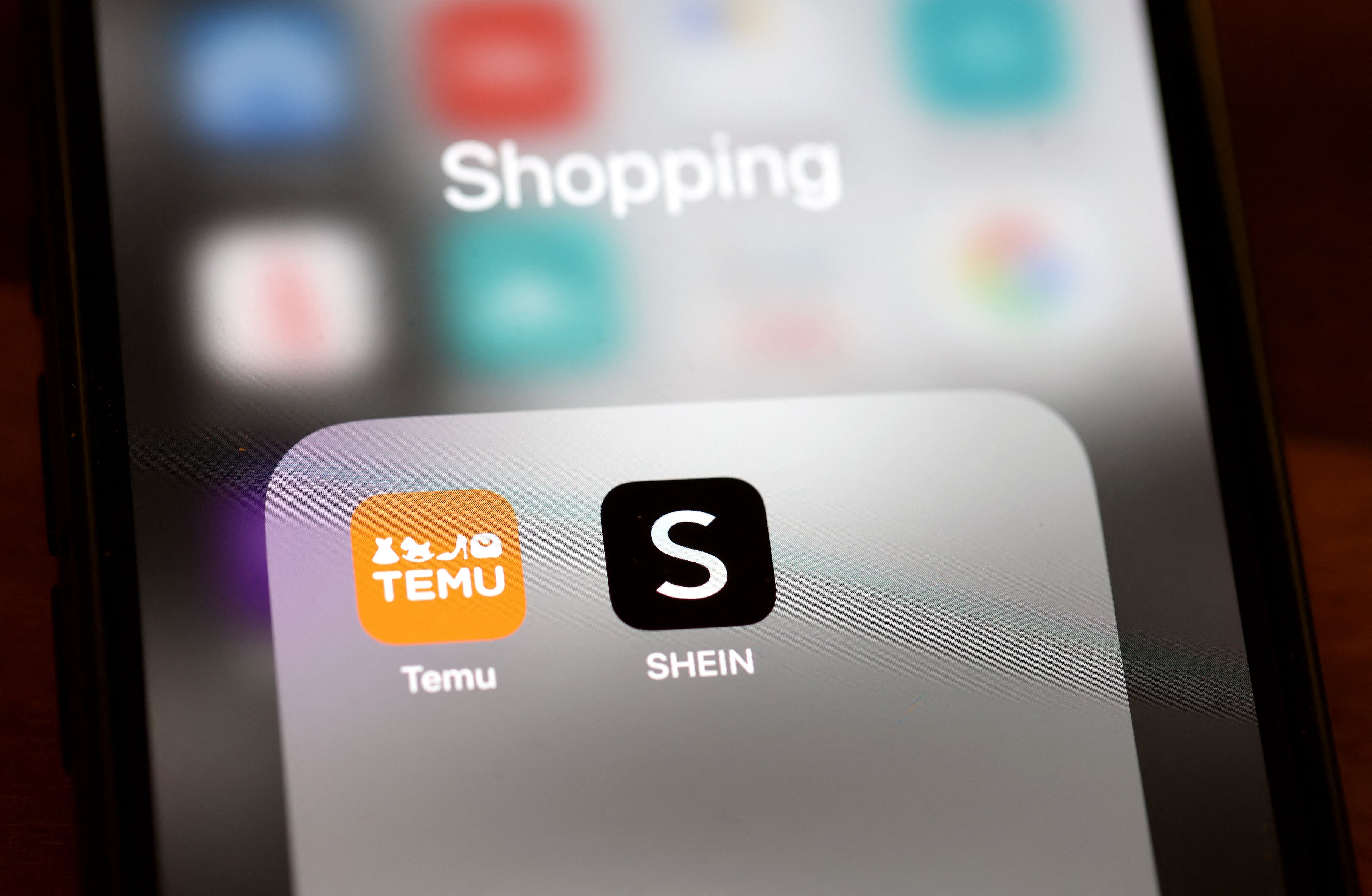 SAN ANSELMO, CALIFORNIA - FEBRUARY 04: In this photo illustration, the apps for Chinese-owned companies Shein and Temu are displayed on a smartphone on February 04, 2025 in San Anselmo, California. China announced retaliatory tariffs on some American imports after U.S. President Donald Trump imposed a 10 percent tariff on certain Chinese products. (Photo Illustration by Justin Sullivan/Getty Images) (Photo by JUSTIN SULLIVAN / GETTY IMAGES NORTH AMERICA / Getty Images via AFP)