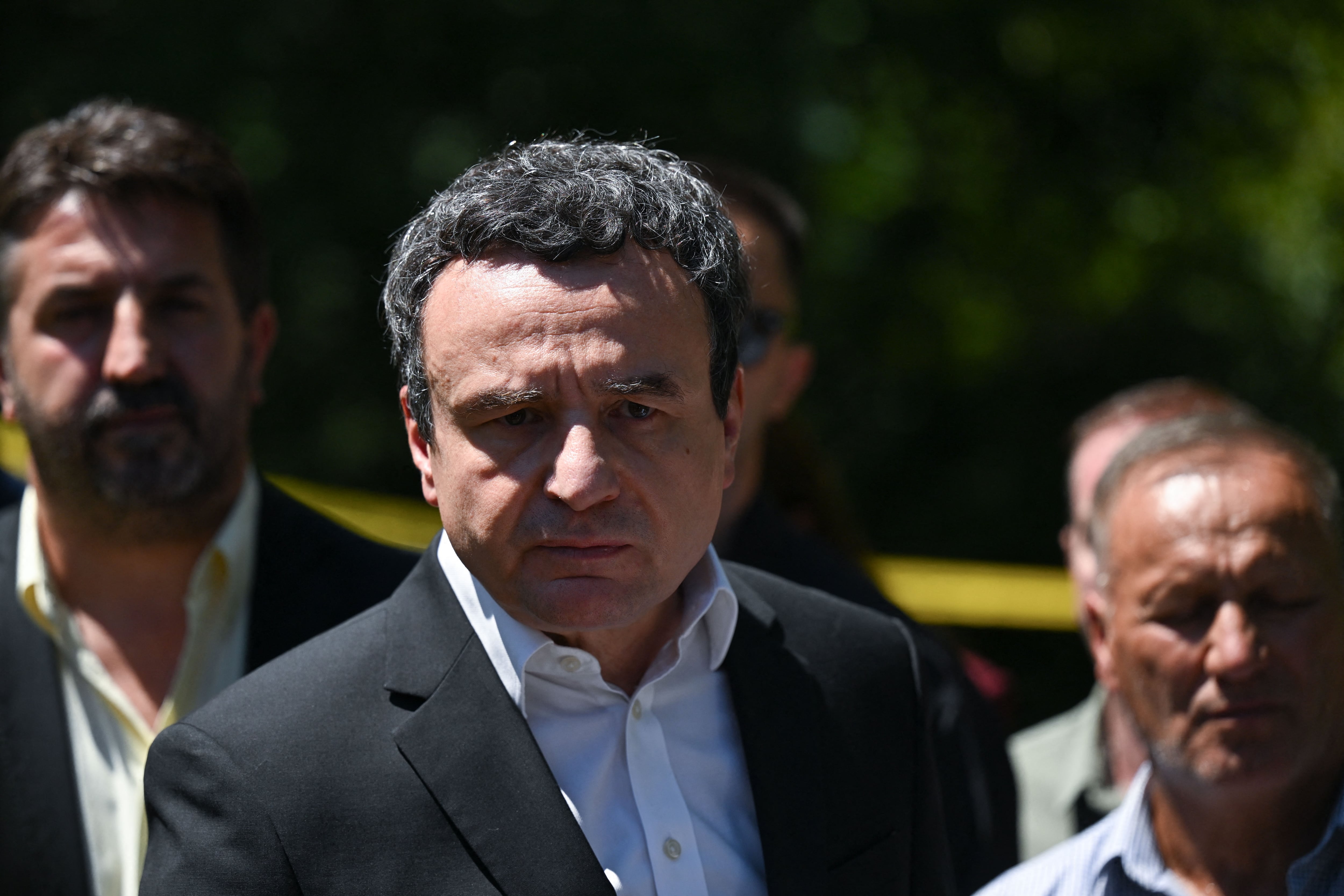 Kosovo's Prime Minister Albin Kurti speaks to the media after visiting a newly discovered possible mass grave site in the village of Kalluder, near the town of Zubin Potok, on August 1, 2026. Kosovo forensic teams have discovered seven bodies at a potential wartime mass grave in the country's north that was discovered recently, the prime minister told AFP on August 1. Excavations at the site started a few days prior with a suspicion that tens of people might have been buried in it. The 1998-1999 war between independence-seeking ethnic Albanian guerrillas and Serbian armed forces killed around 13,000 people and left 4,000 missing. (Photo by Armend NIMANI / AFP)