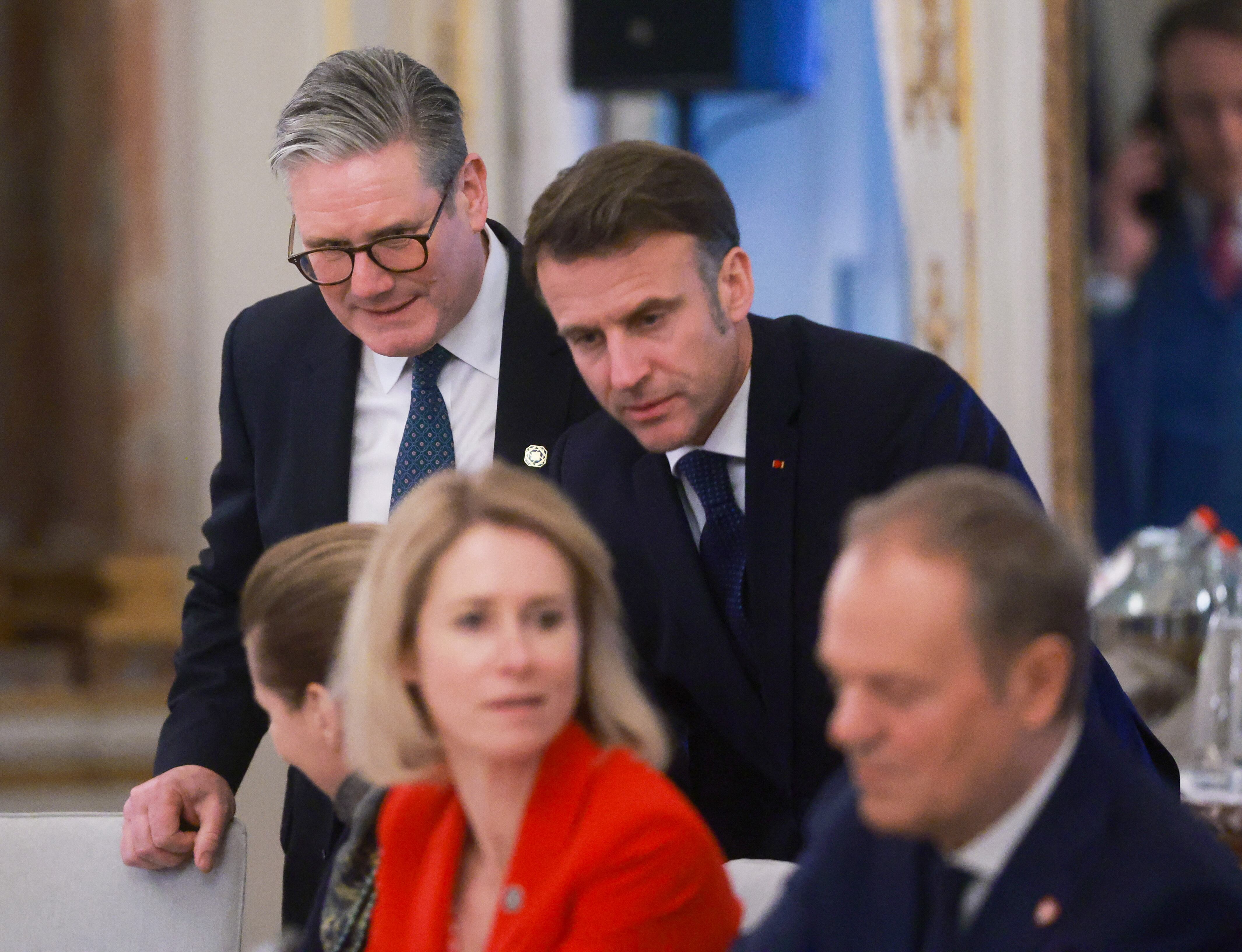 (From L) Britain's Prime Minister Keir Starmer, France's President Emmanuel Macron, High Representative for Foreign Affairs and Security Policy Kaja Kallas and Polish Prime Minister Donald Tusk attend a dinner on the occasion of the European Union leaders' informal retreat, at the Palais d'Egmont in Brussels, on February 3, 2025. (Photo by Olivier HOSLET / PO