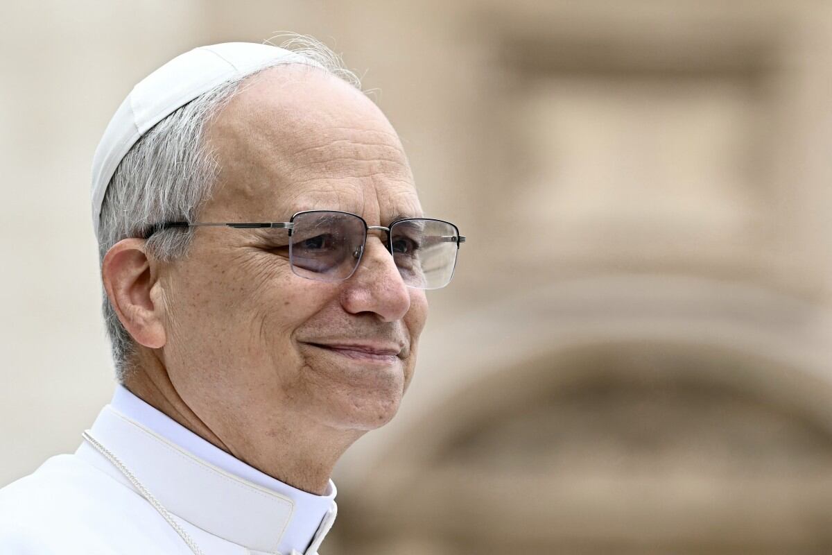Pope Leo XIV waves to the crowd during the weekly general audience at St Peter's Square in The Vatican on May 21, 2025. (Photo by Filippo MONTEFORTE / AFP)