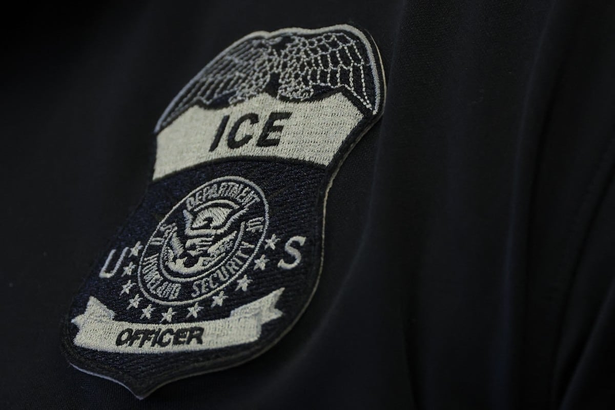 Acting ICE Director Todd Lyons wears an US ICE officer patch during a news conference at the Wilshire Federal Building in Los Angeles on June 12, 2025. US President Donald Trump said Thursday that Los Angeles was "safe and sound" for the past two nights, crediting his deployment of thousands of troops to quell anti-deportation protests, as California prepared for a legal showdown over his unprecedented move. With protests spreading across the United States, a night-time curfew has been in place in its second-largest city with authorities tackling vandalism and looting that scarred a few city blocks. (Photo by Patrick T. Fallon / AFP)