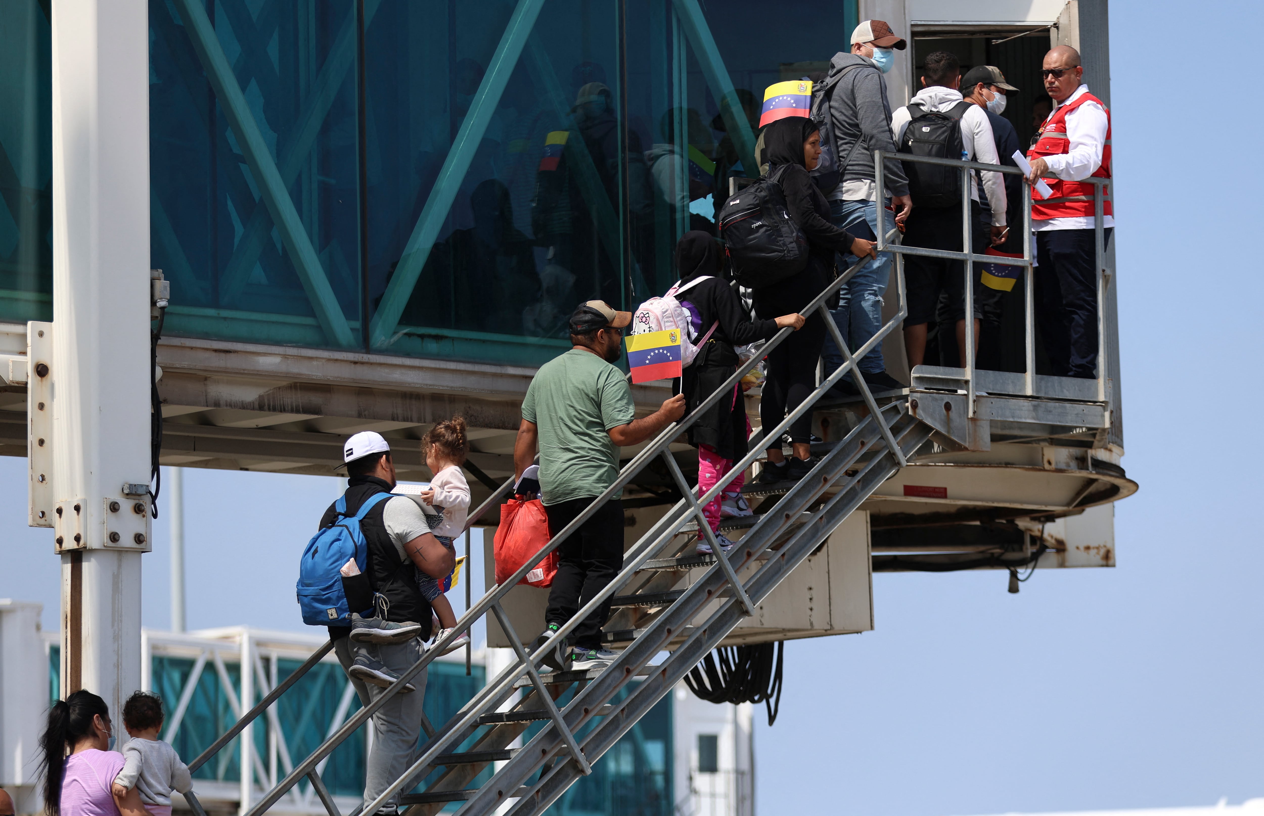 Venezuelan migrants deported from the US arrive at Simon Bolivar International Airport in Maiquetia, Venezuela on February 24, 2025. (Photo by Pedro MATTEY / AFP)
