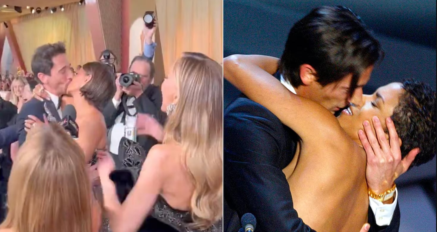 Halle Berry y Adrien Brody dándose un beso.