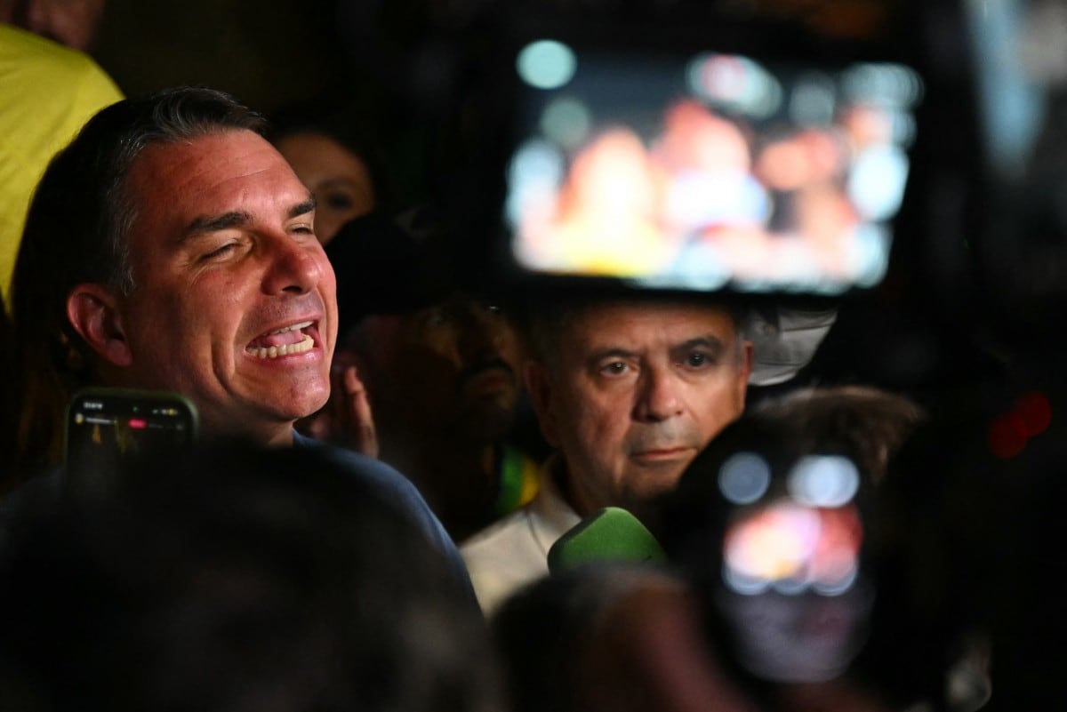 Brazil's right-wing senator and presidential candidate for the Liberal Party (PL) Flavio Bolsonaro speaks to supporters following the partial results of the presidential election in Brasilia, Brazil on October 4, 2026. Brazilian senator Flavio Bolsonaro, son of the far-right former leader Jair Bolsonaro, finished ahead of President Luiz Inacio Lula da Silva in the election on October 4, 2026, which will go to a run-off in three weeks. (Photo by Evaristo SA / AFP)