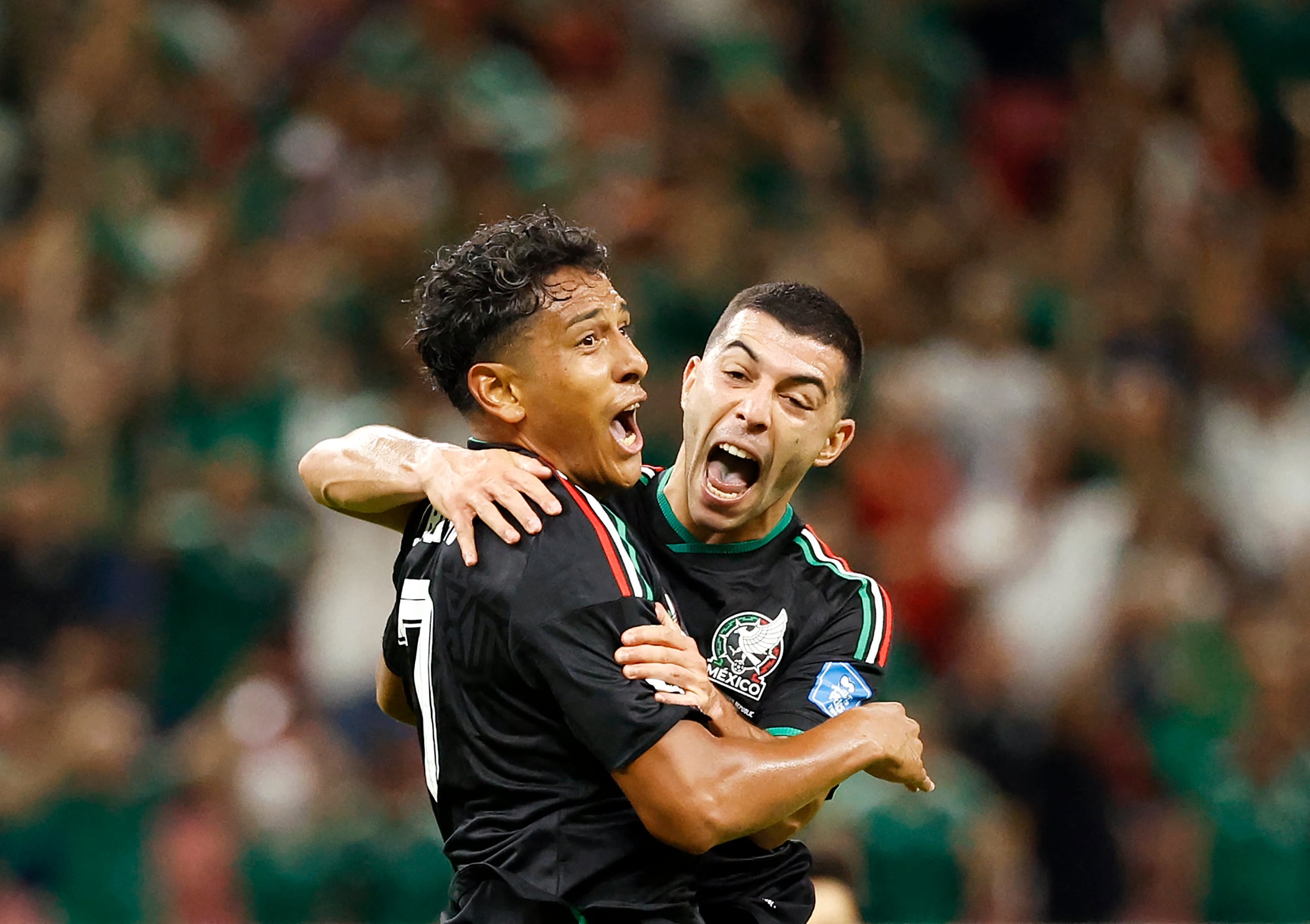 Mexico's midfielder #07 Luis Romo celebrates with teammate midfielder #06 Erik Lira scoring his team's first goal during the 2026 World Cup Group A football match between Mexico and South Korea at the Guadalajara Stadium in Zapopan on June 18, 2026. (Photo by Ulises RUIZ / AFP)