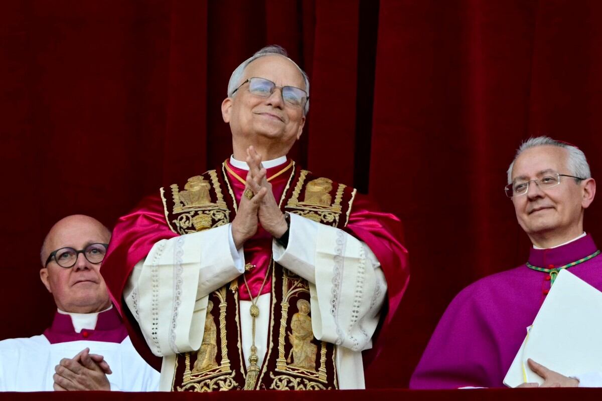 Newly elected Pope Leo XIV, Robert Prevost addresses the crowd from the main central loggia balcony of the St Peter's Basilica for the first time, after the cardinals ended the conclave, in The Vatican, on May 8, 2025. Robert Francis Prevost was on Thursday elected the first pope from the United States, the Vatican announced. A moderate who was close to Pope Francis and spent years as a missionary in Peru, he becomes the Catholic Church's 267th pontiff, taking the papal name Leo XIV. (Photo by Tiziana FABI / AFP)