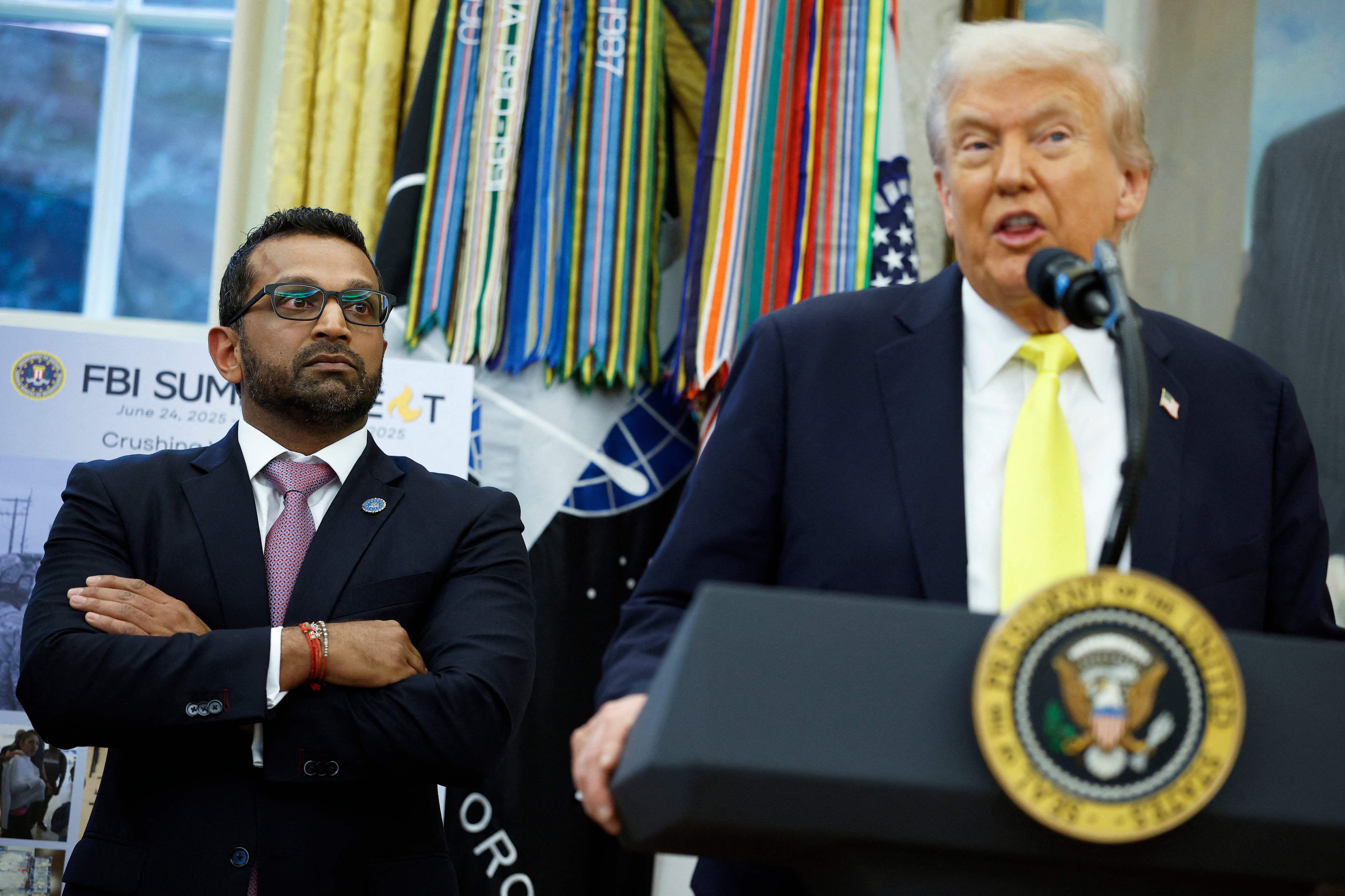 WASHINGTON, DC - OCTOBER 15: Federal Bureau of Investigation Director Kash Patel (L) looks on as U.S. President Donald Trump speaks during a press conference in the Oval Office of the White House on October 15, 2025 in Washington, DC. Trump and Patel provided an update on the Trump administration�s progress in reducing violent crime. Kevin Dietsch/Getty Images/AFP (Photo by Kevin Dietsch / GETTY IMAGES NORTH AMERICA / Getty Images via AFP)