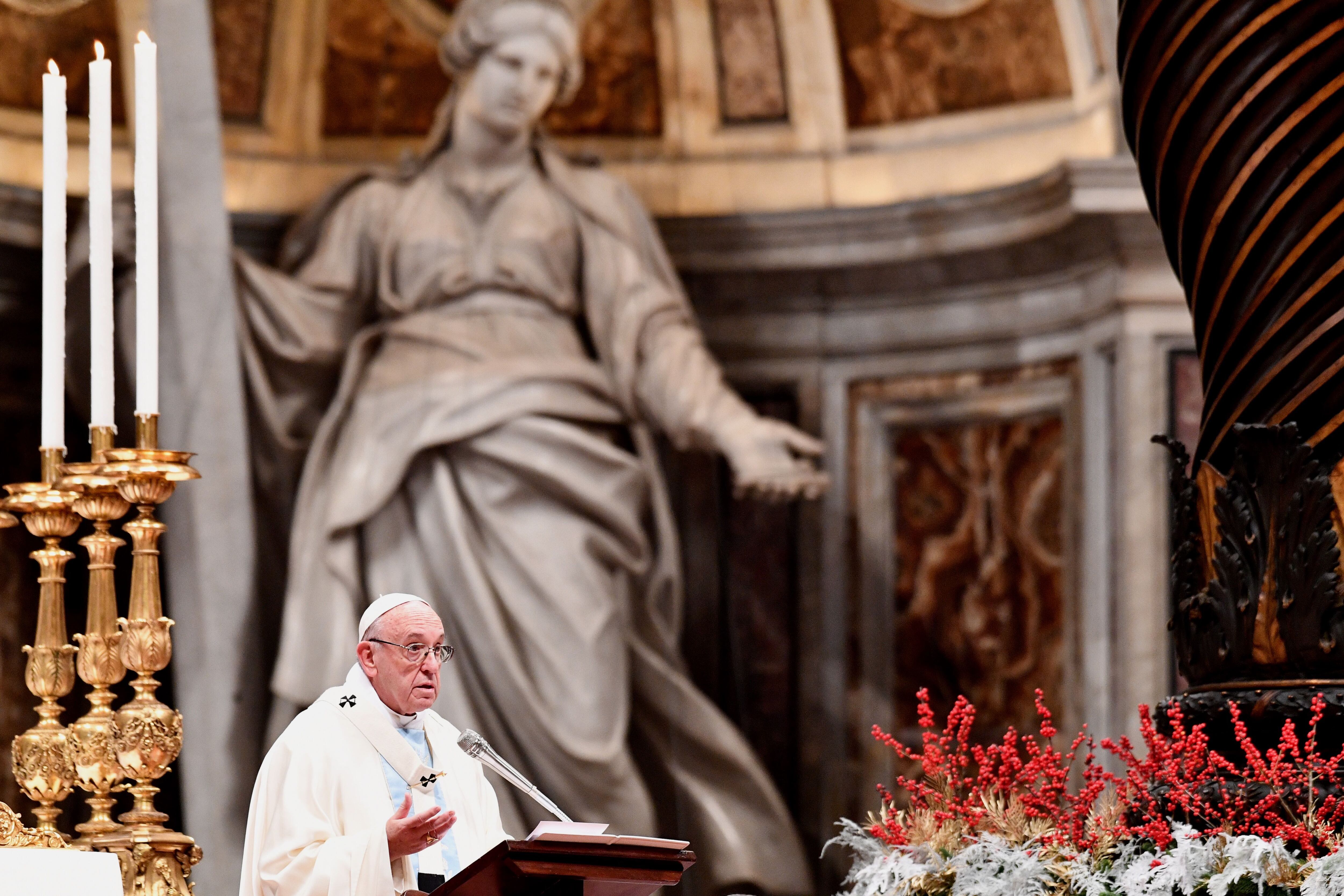 Pope Francis delivers his message as he leads the holy mass to mark the world day of peace, in St. Peter's Basilica at the Vatican on January 1, 2018. / AFP PHOTO / Vincenzo PINTO