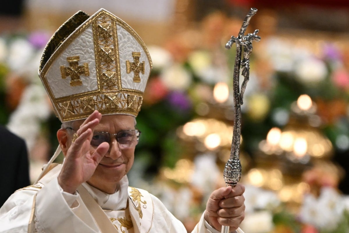 Pope Leo XIV greets people at the end of the Easter vigil as part of the Holy Week celebrations, at St Peter's basilica in the Vatican on April 4, 2026.