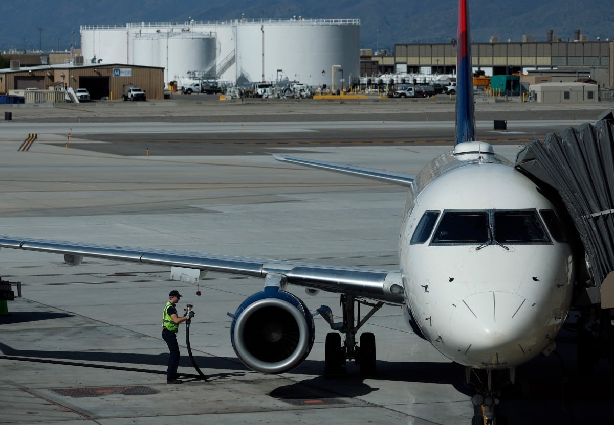 A worker fuels a Delta Airlines plane at Salt Lake City International Airport on April 09, 2026 in Salt Lake City, Utah.