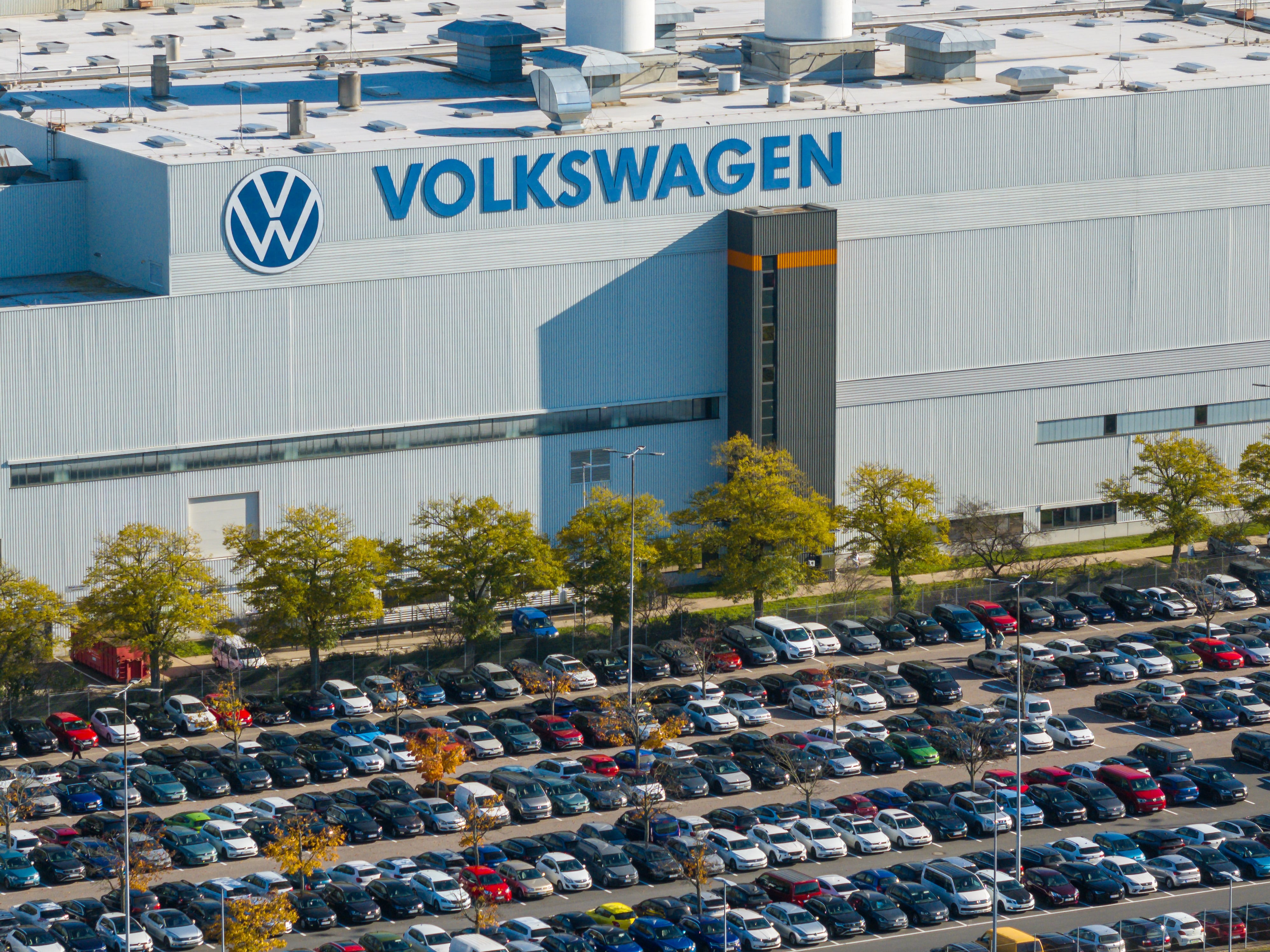 Aerial view taken on October 28, 2024 shows the plant of German car maker Volkswagen (VW) in Zwickau, eastern Germany. Ailing auto giant Volkswagen plans to close at least three factories in Germany and slash tens of thousands of jobs as part of drastic cost-savings drive, workers' representatives said on October 28, 2024, calling the proposed cuts "of historic dimensions". The plan laid out by management, which affects the namesake VW brand, also includes a 10-percent pay cut for all staff, the company's powerful works council said in an update to staff. (Photo by AFP)