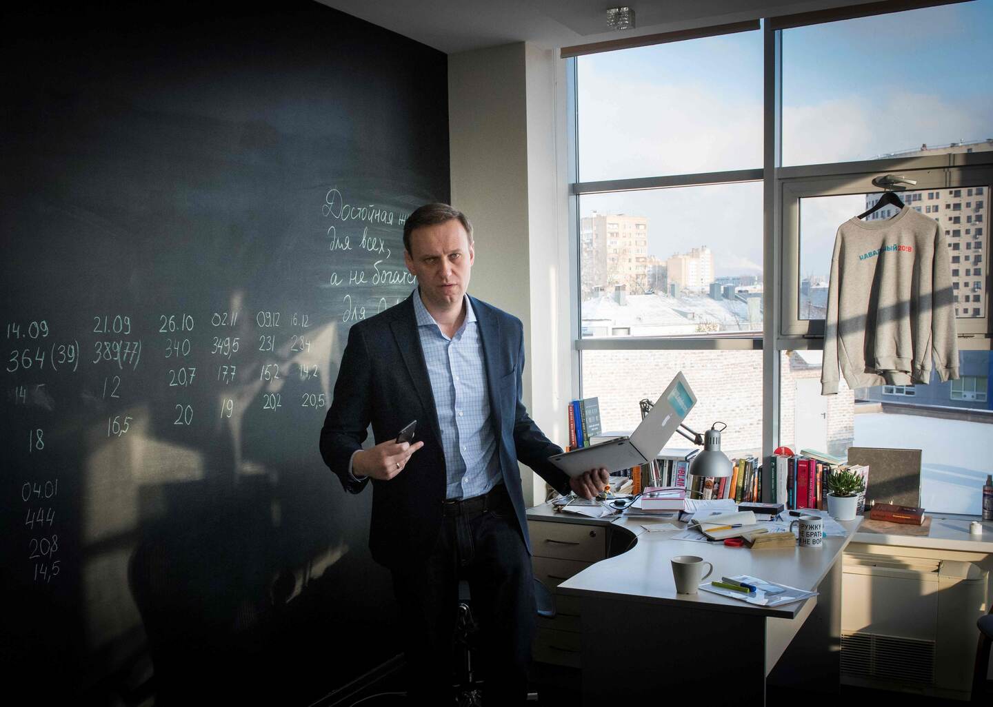 Russian opposition leader Alexei Navalny poses at the office of his Anti-corruption Foundation (FBK) in Moscow on January 16, 2018.
The Kremlin's top critic Alexei Navalny has slammed Russia's March presidential election, in which he is barred from running, as a sham meant to "re-appoint" Vladimir Putin on his way to becoming "emperor for life". / AFP PHOTO / Mladen ANTONOV