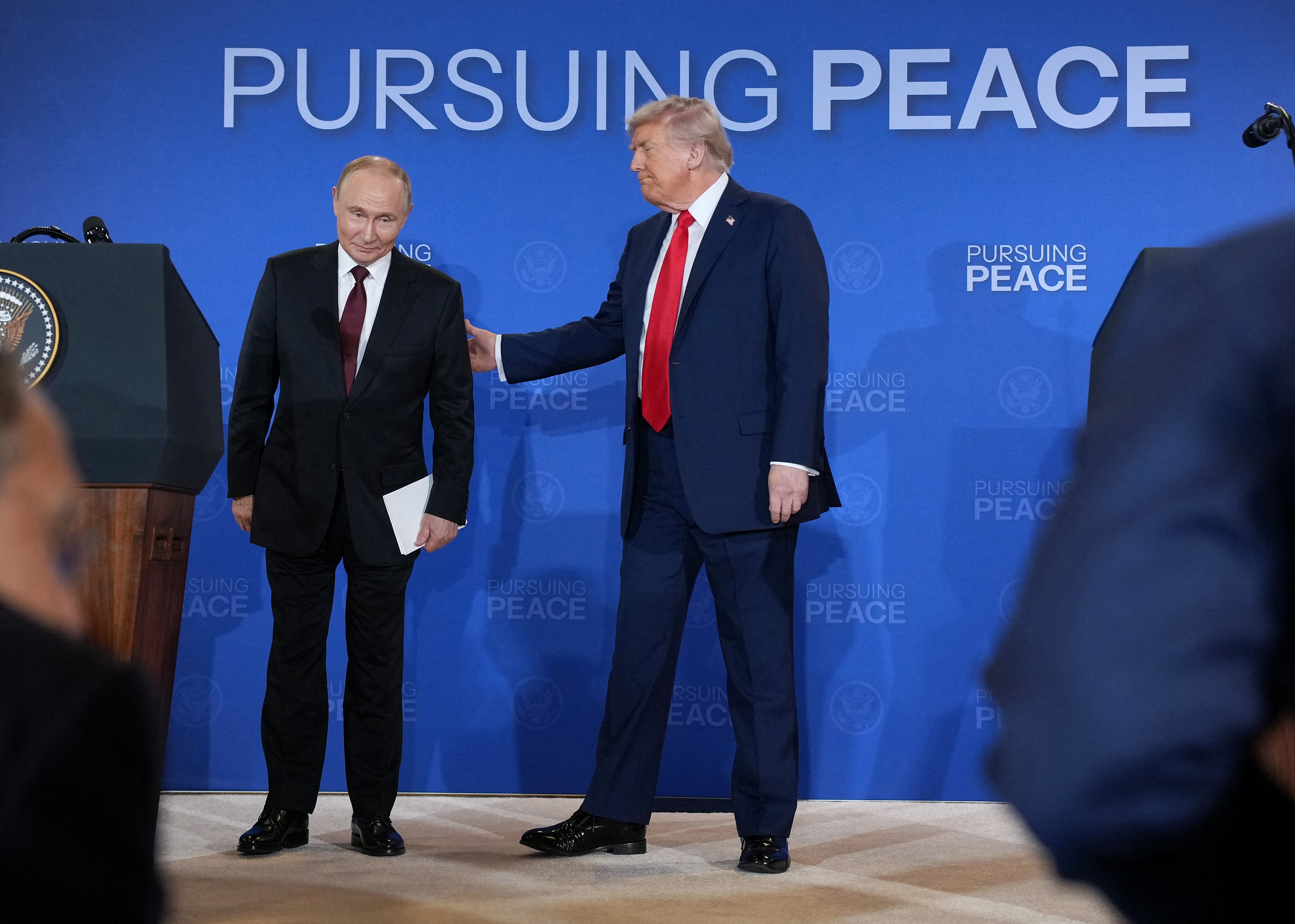 ANCHORAGE, ALASKA - AUGUST 15: U.S. President Donald Trump (R) and Russian President Vladimir Putin leave following a press conference at Joint Base Elmendorf-Richardson on August 15, 2025 in Anchorage, Alaska. The two leaders are meeting for peace talks aimed at ending the war in Ukraine. Andrew Harnik/Getty Images/AFP