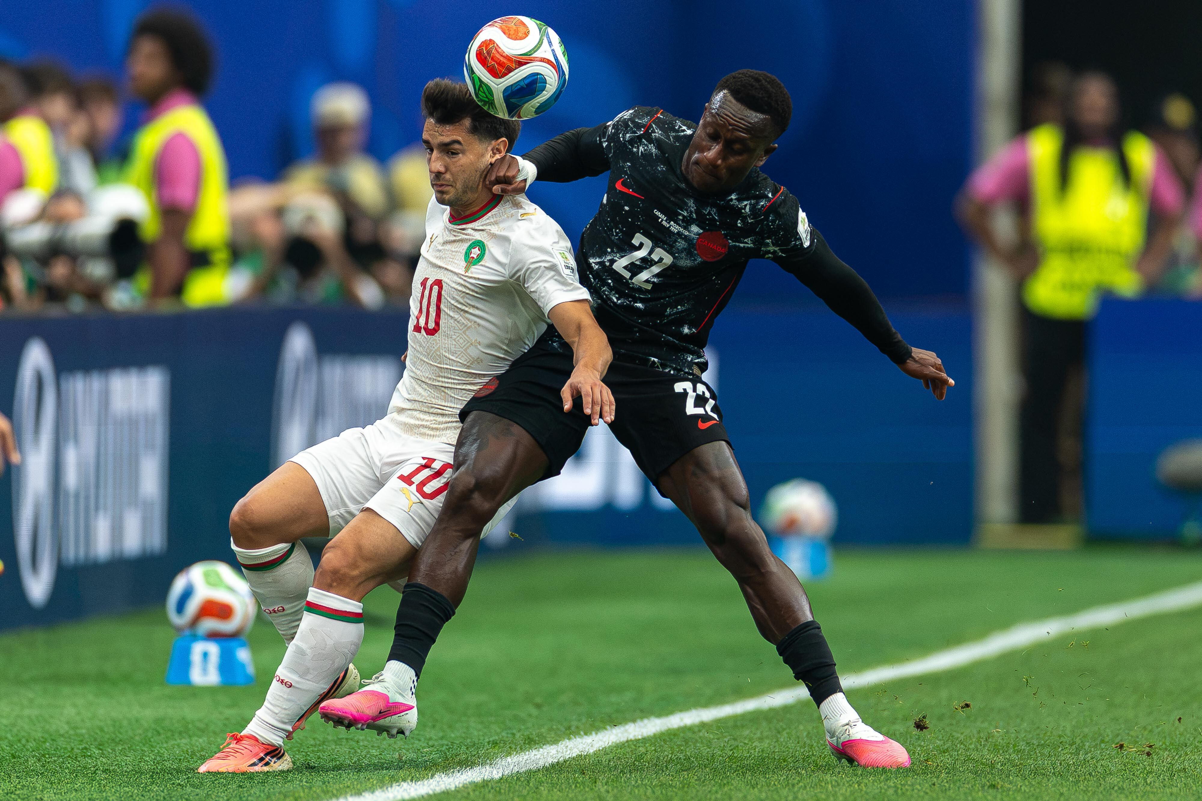 Morocco�s #10 forward Brahim Diaz and Canada�s #22 defender Richie Laryea, fight for possession during FIFA World Cup 2026, Canada - Morocco at the Houston Stadium on July 04, 2026. (Photo by Leo Barrilari / Odyssey Images via AFP)