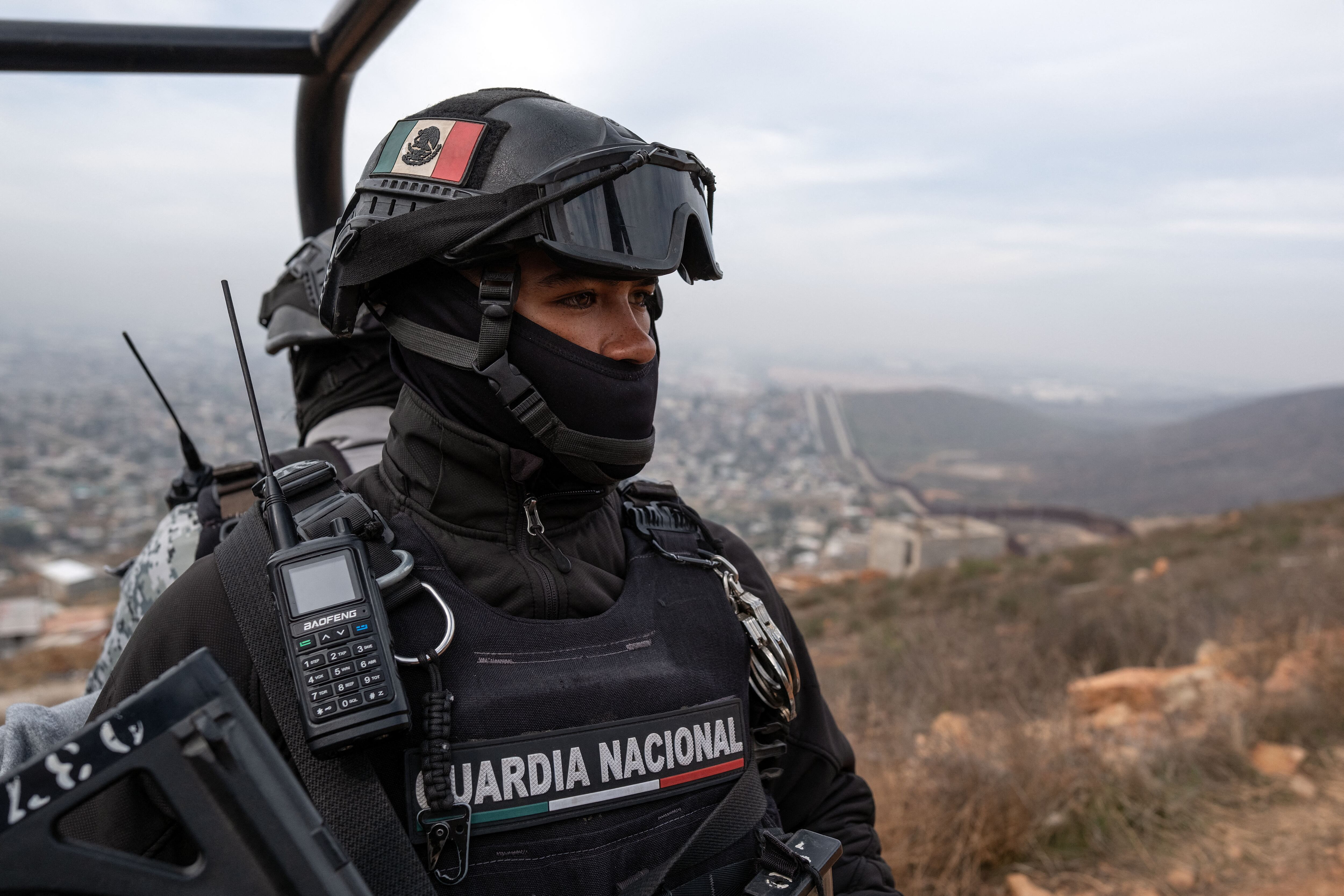 A Mexican National Guard officer patrols at a high point of El Nido de las Aguilas in eastern Tijuana, Baja California State, Mexico, on March 5, 2025, on the Mexican side of the Mexico-US bord