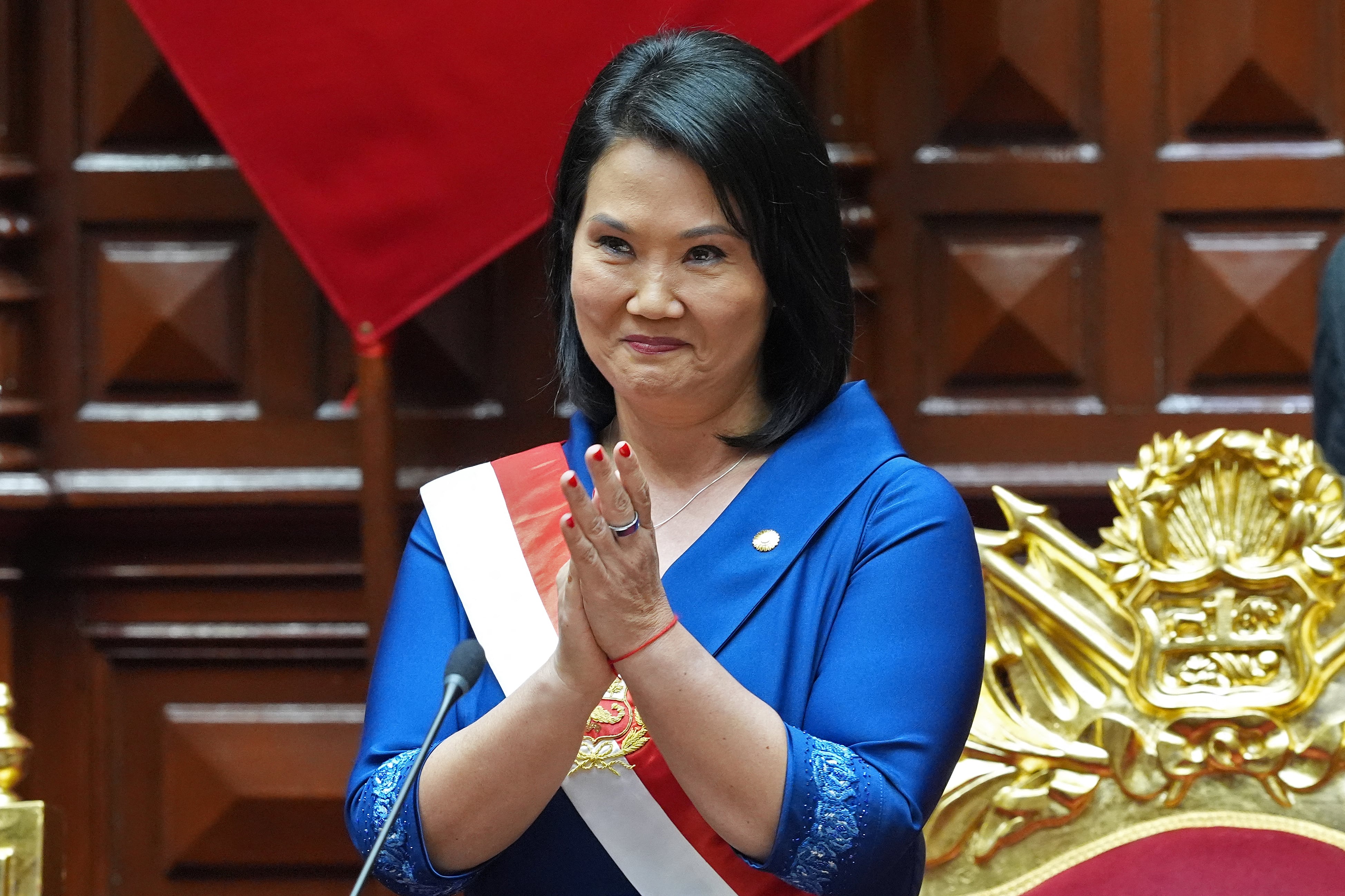 Peru's President Keiko Fujimori applauds after taking the oath of office in Lima, on July 28, 2026. Peru's right-wing president-elect Keiko Fujimori took office on July 28, 2026, vowing to tackle the wave of crime sweeping the Andean nation. Fujimori won the June 7 presidential runoff by fewer than 50,000 votes, after losing the past three runoffs. (Photo by Guadalupe Pardo / POOL / AFP)