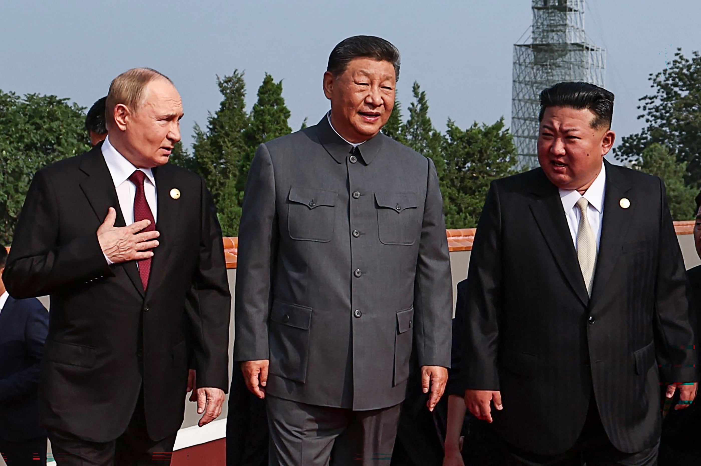 In this pool photograph distributed by the Russian state agency Sputnik, (L-R) Russia's President Vladimir Putin walks with China's President Xi Jinping and North Korea's leader Kim Jong Un before a military parade marking the 80th anniversary of victory over Japan and the end of World War II, in Beijing�s Tiananmen Square on September 3, 2025. (Photo by Alexander KAZAKOV / POOL / AFP)