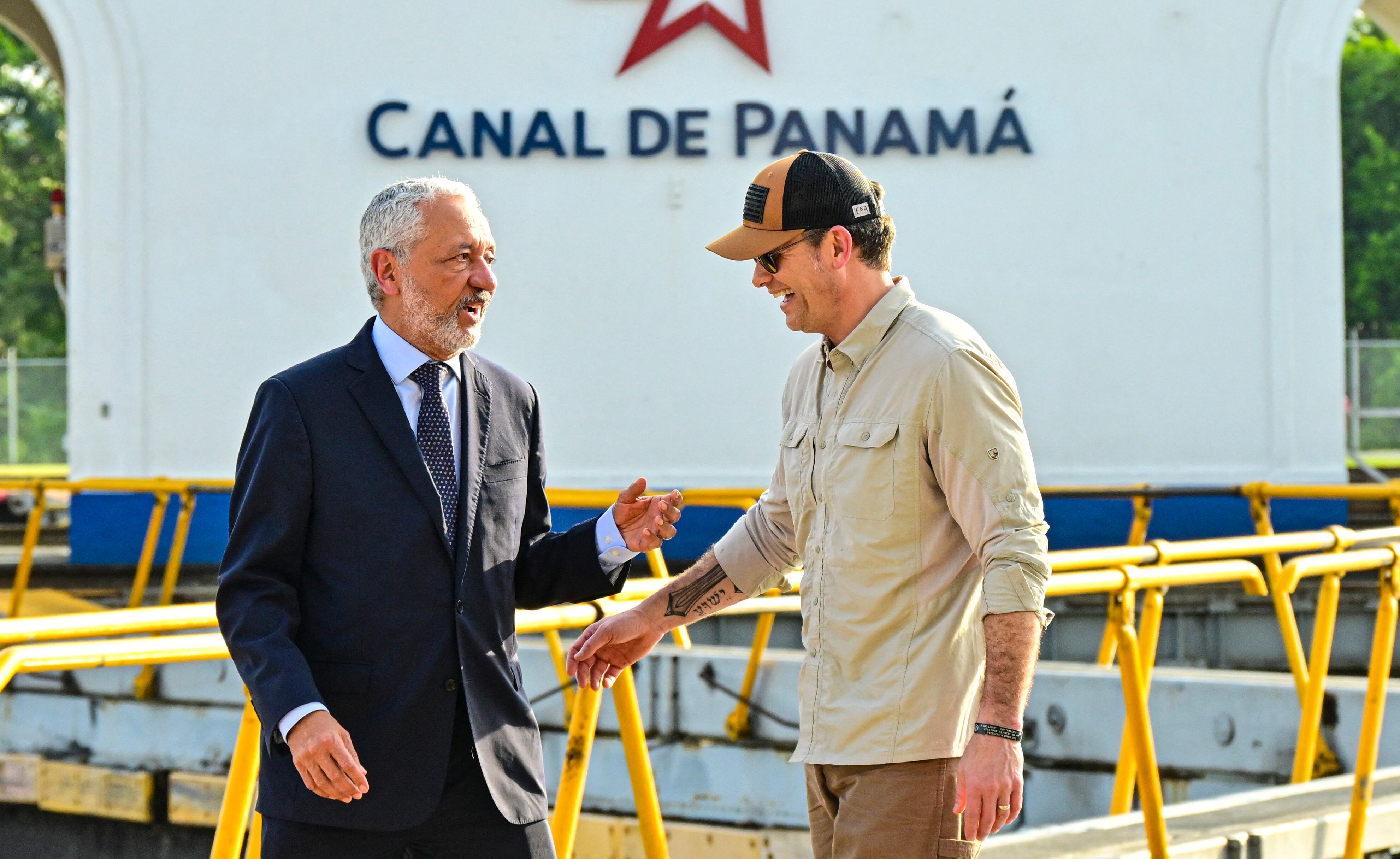 US Secretary of Defense Pete Hegseth (R) talks with Panama Canal Administrator Ricaurte Vasquez during a visit to the Miraflores locks of the Panama Canal in Panama City on April 8, 2025. (Photo by MARTIN BERNETTI / AFP)