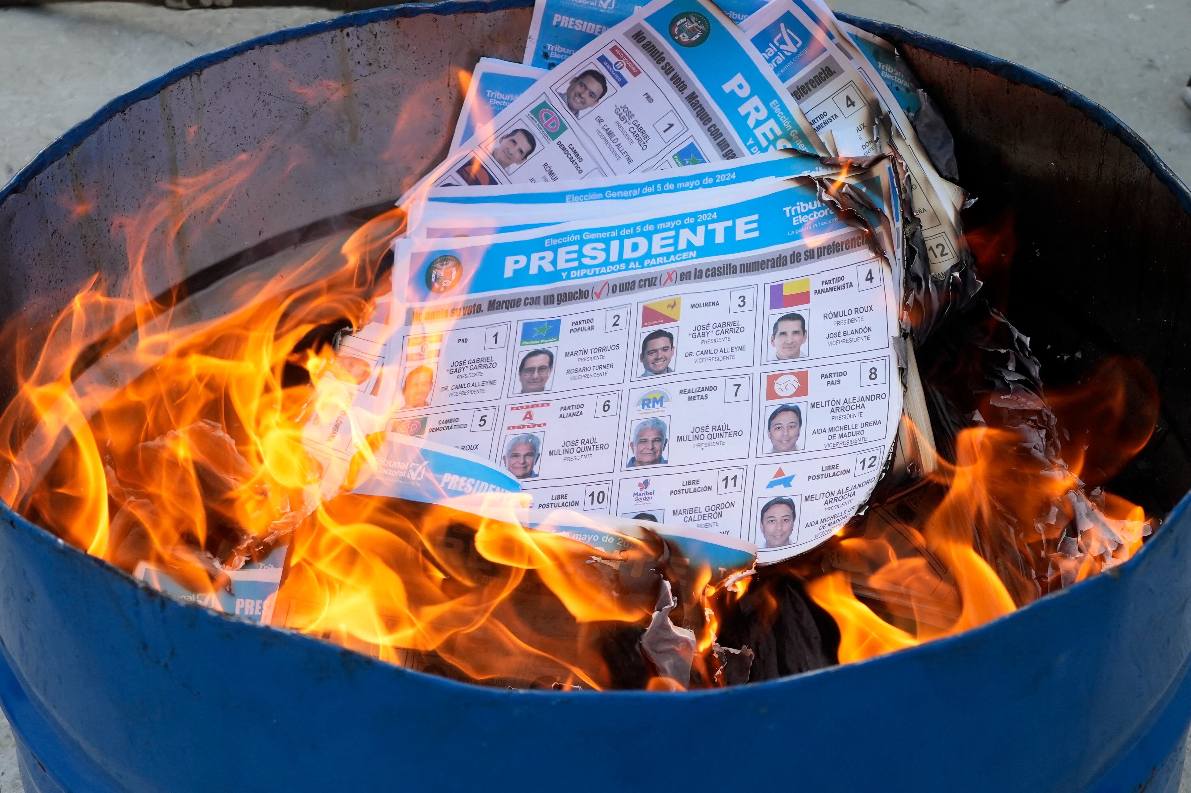 Unused ballots are burned by election officials after the closing of polling stations in Panama City on May 5, 2024, during Panama's presidential election. (Photo by ARNULFO FRANCO / AFP)